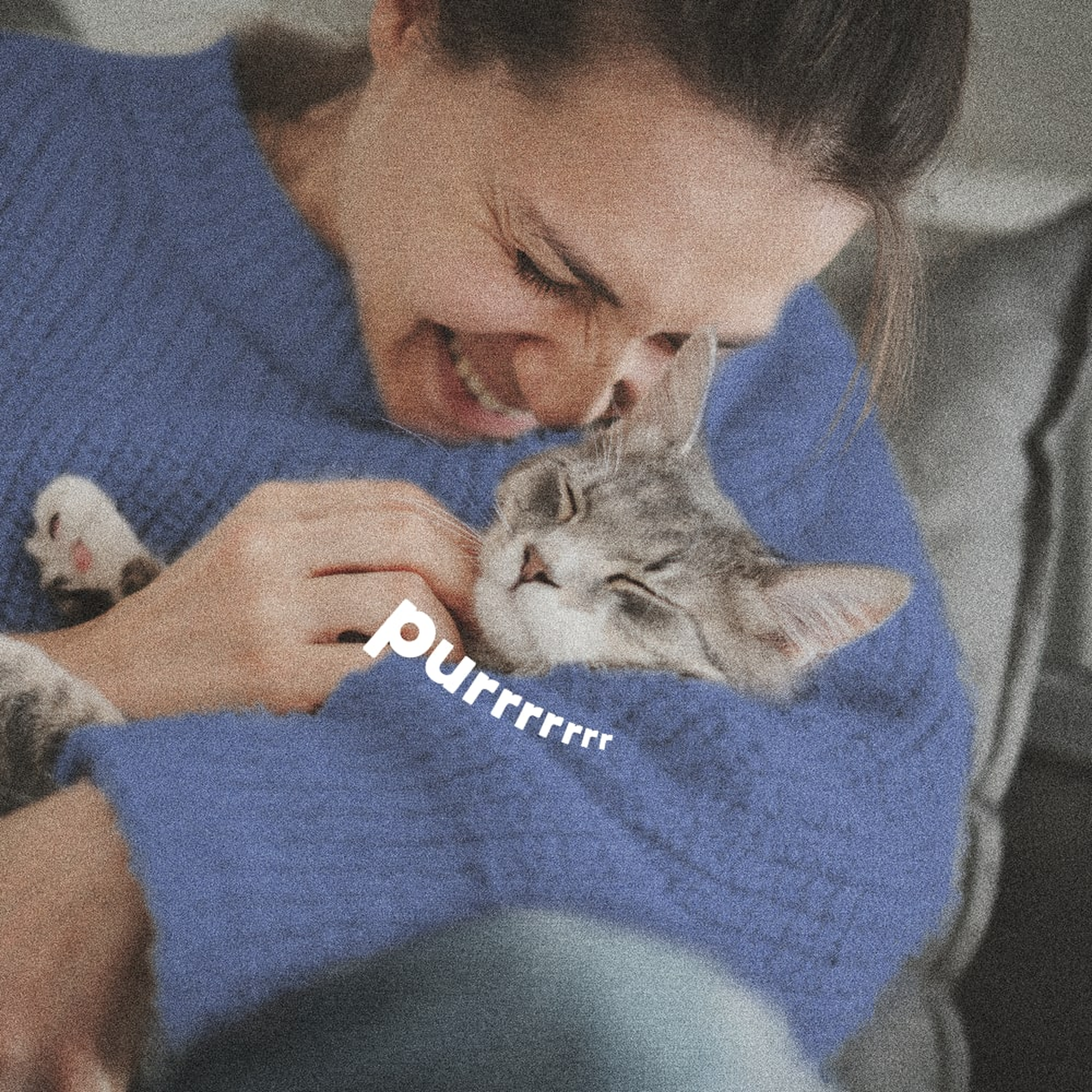 Woman cuddling her cat after a flea and tick bath