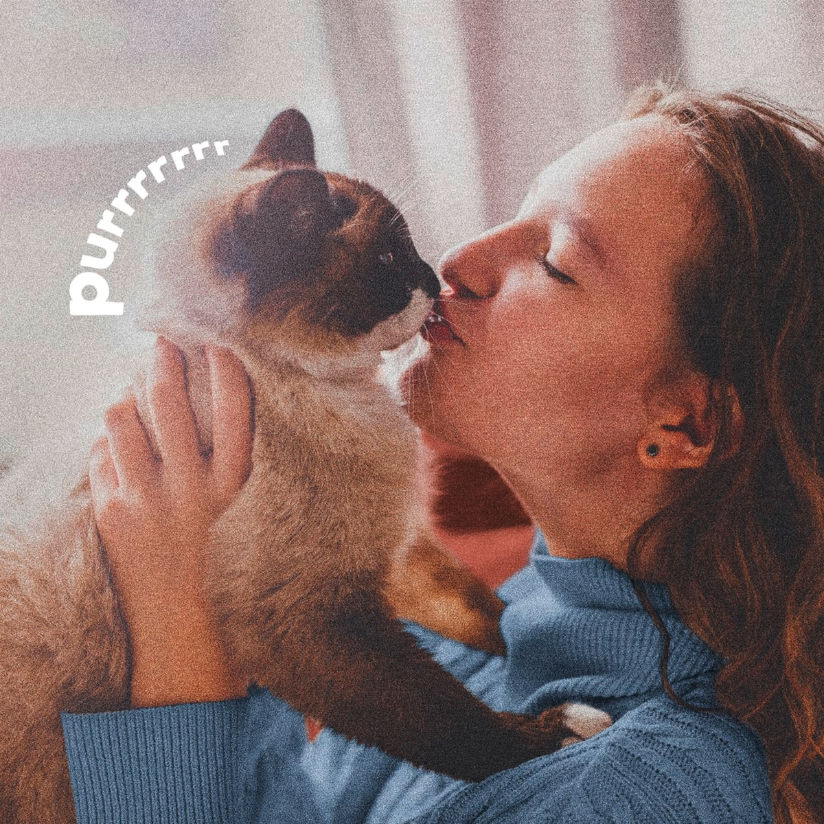 Woman hugging her cat after a flea and tick dip