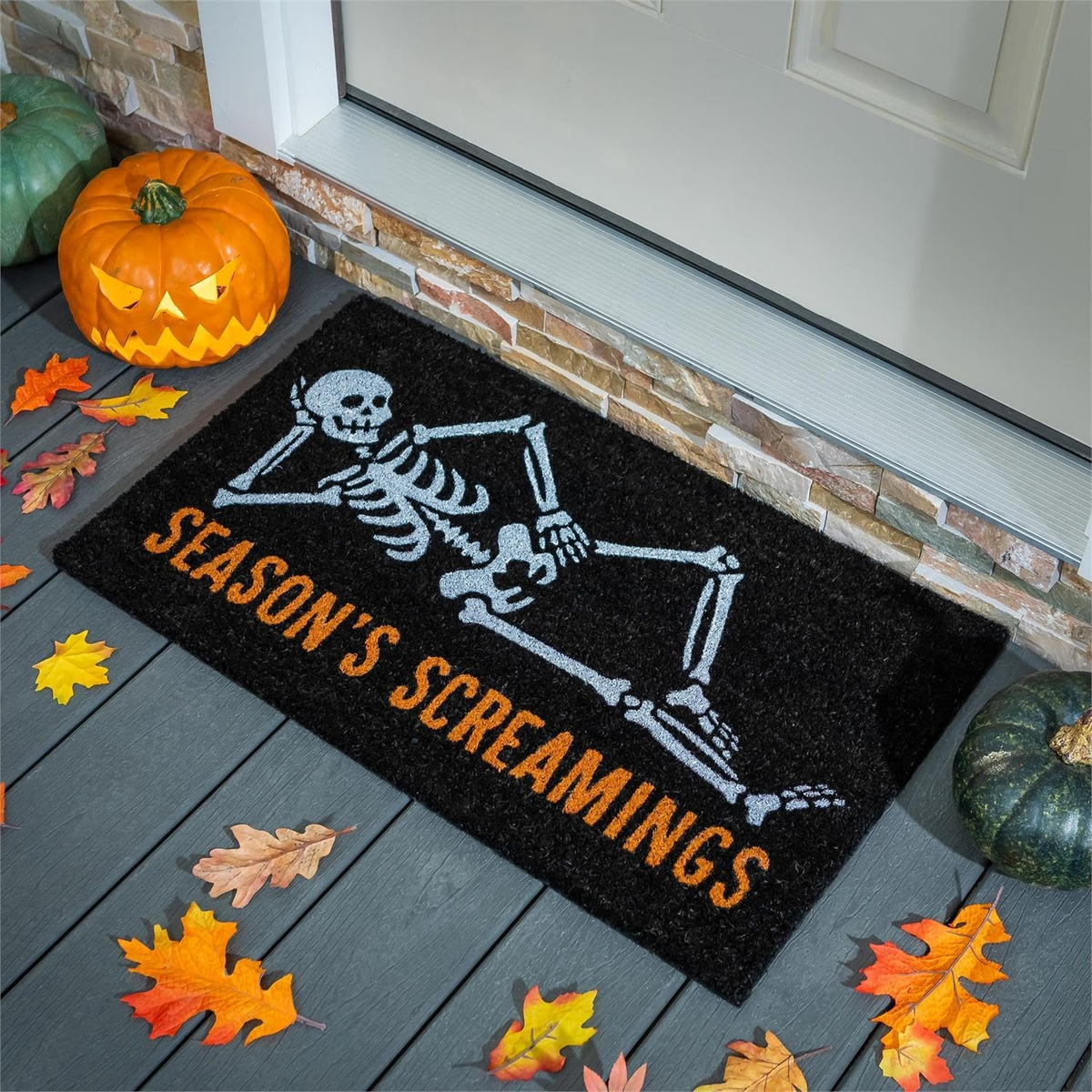 Evergreen Skeleton Season's Screamings Coir Mat -- on a porch step for Halloween