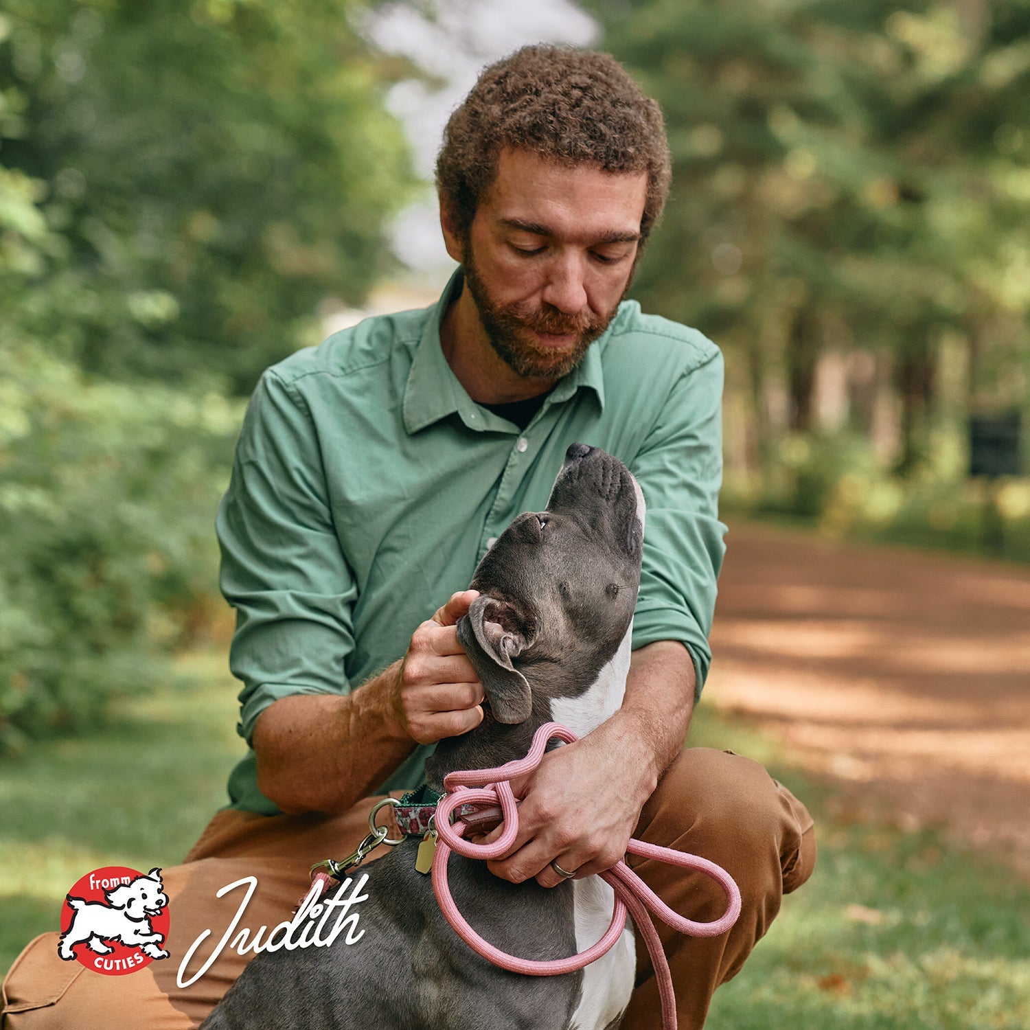 Grey and white dog Judith getting ear scratches on a wooded path, from the Fromm Cuties gallery