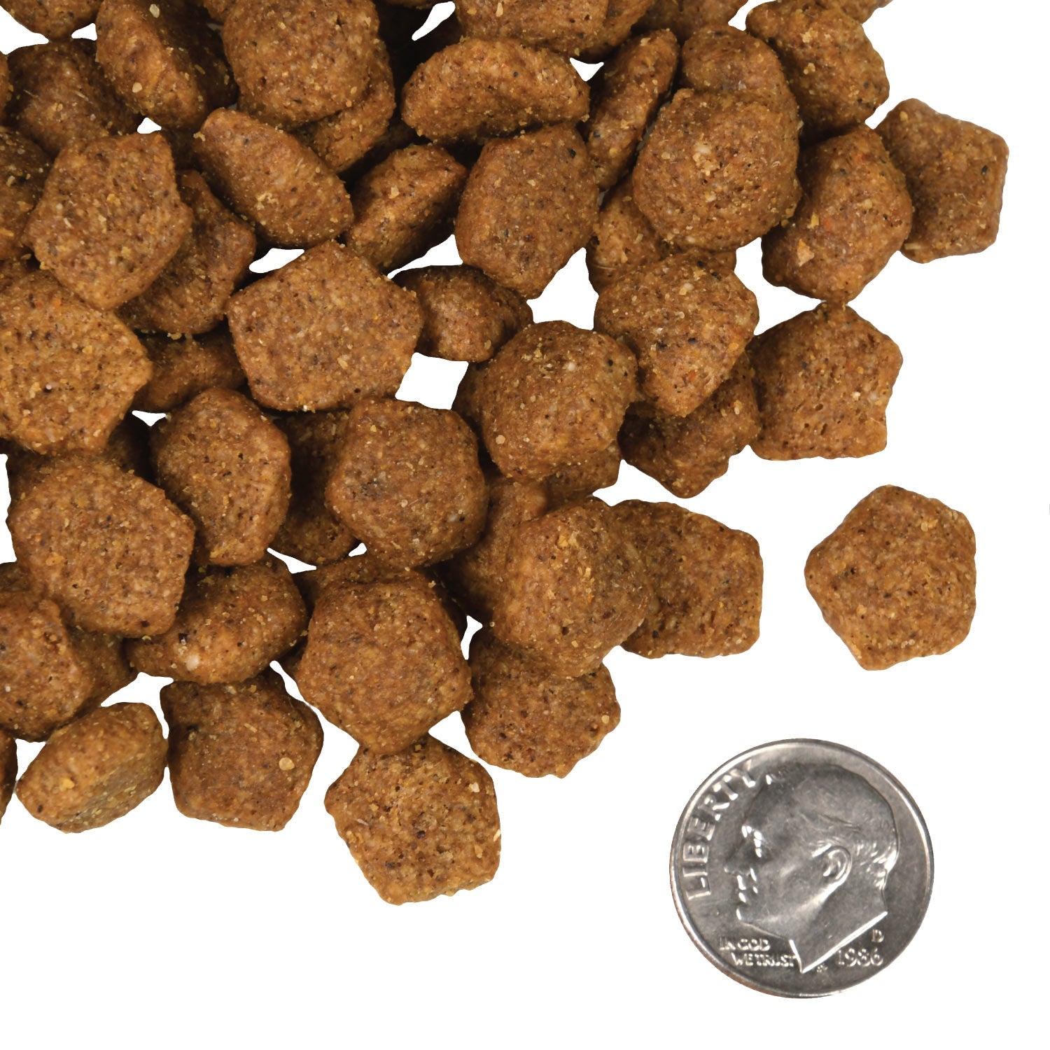 A small pile of Fromm Duck A La Veg kibble next to a dime for scale