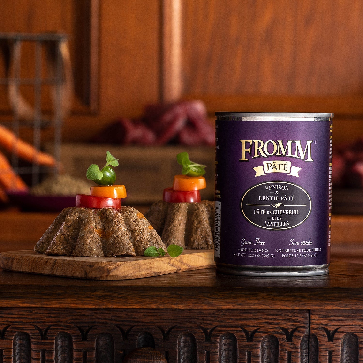 A can of Fromm Pâté Venison & Lentil beside molded pâté portions garnished with sliced vegetables and microgreens