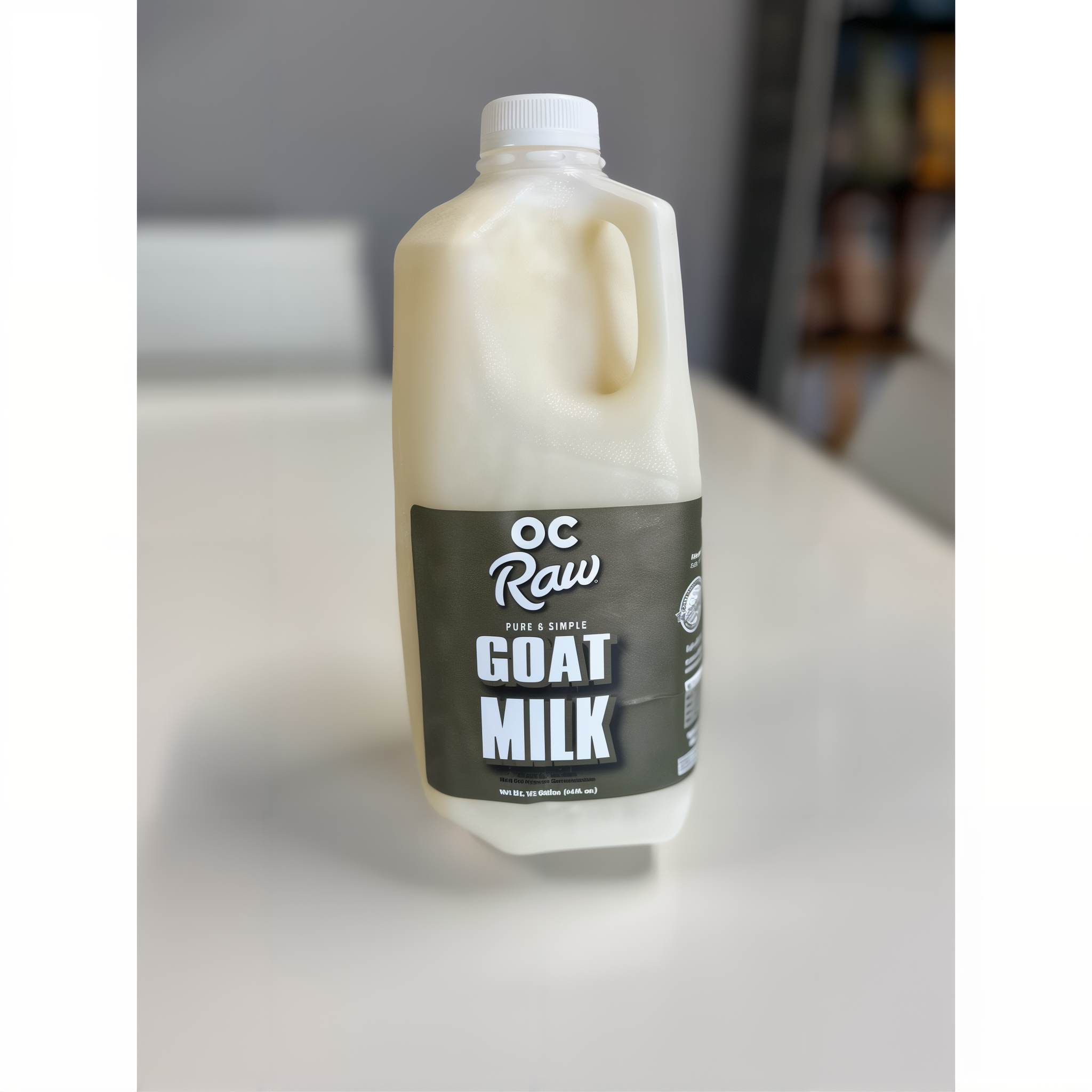 OC Raw Dog Goat Milk 64 fl oz half gallon bottle photographed on a countertop