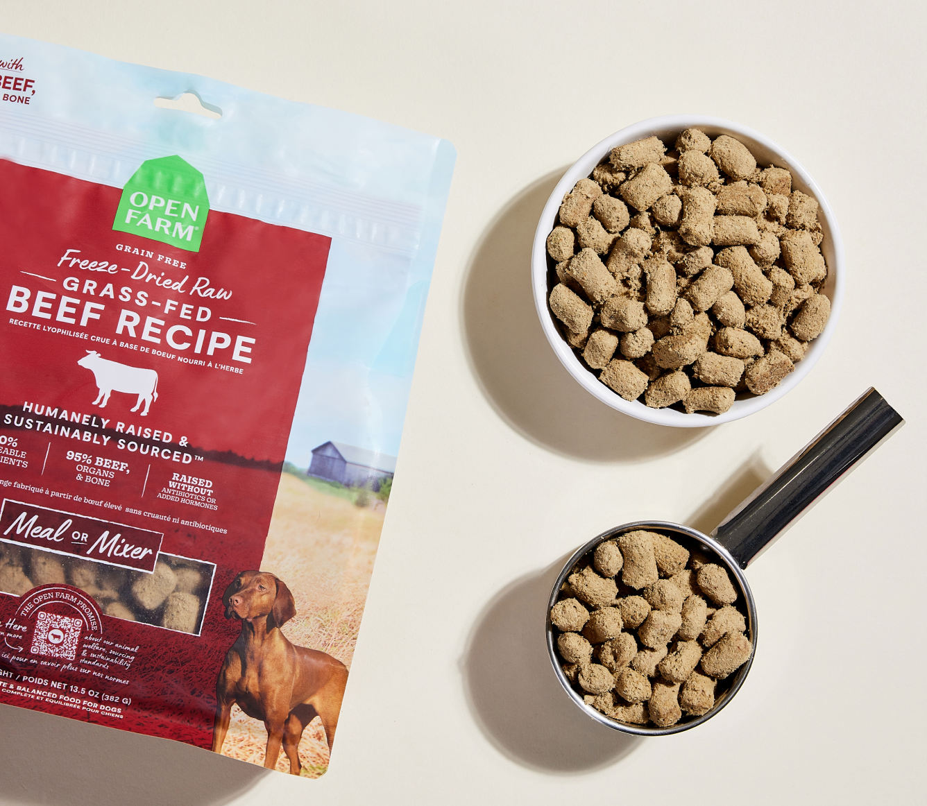 Open Farm Grass-Fed Beef freeze dried morsels in a bowl and measuring scoop