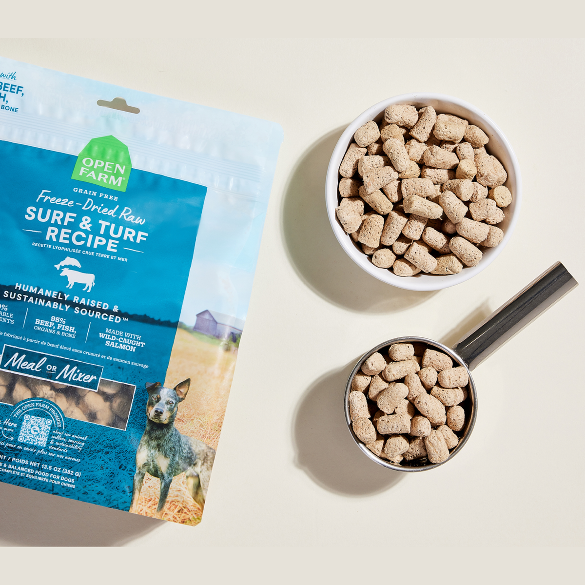 Open Farm Surf & Turf Freeze Dried Raw Morsels for Dogs -- open farm surf & turf freeze dried morsels in a bowl and measuring scoop