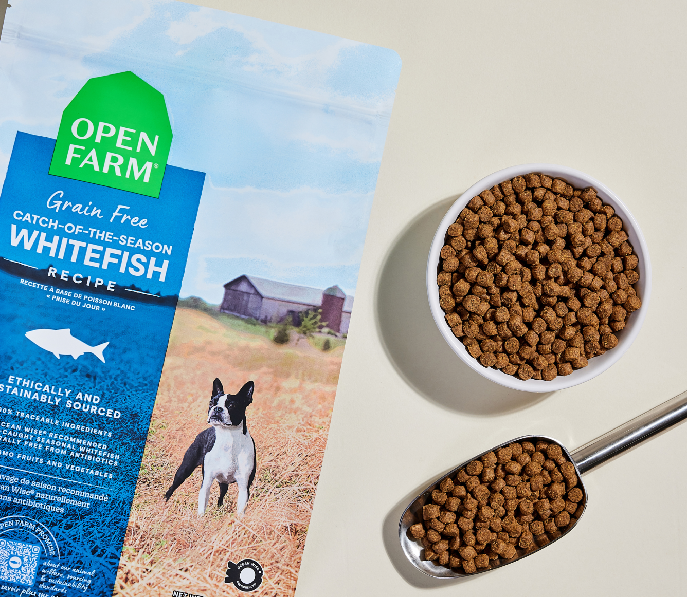 Open Farm Whitefish Grain-Free Dog Kibble kibble in a bowl with a serving scoop
