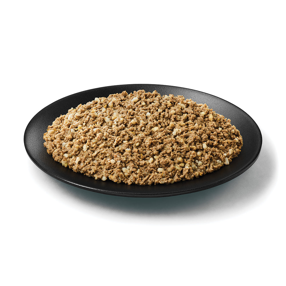 Pro Plan Sensitive Skin & Stomach lamb and oat meal pate served on a dark plate