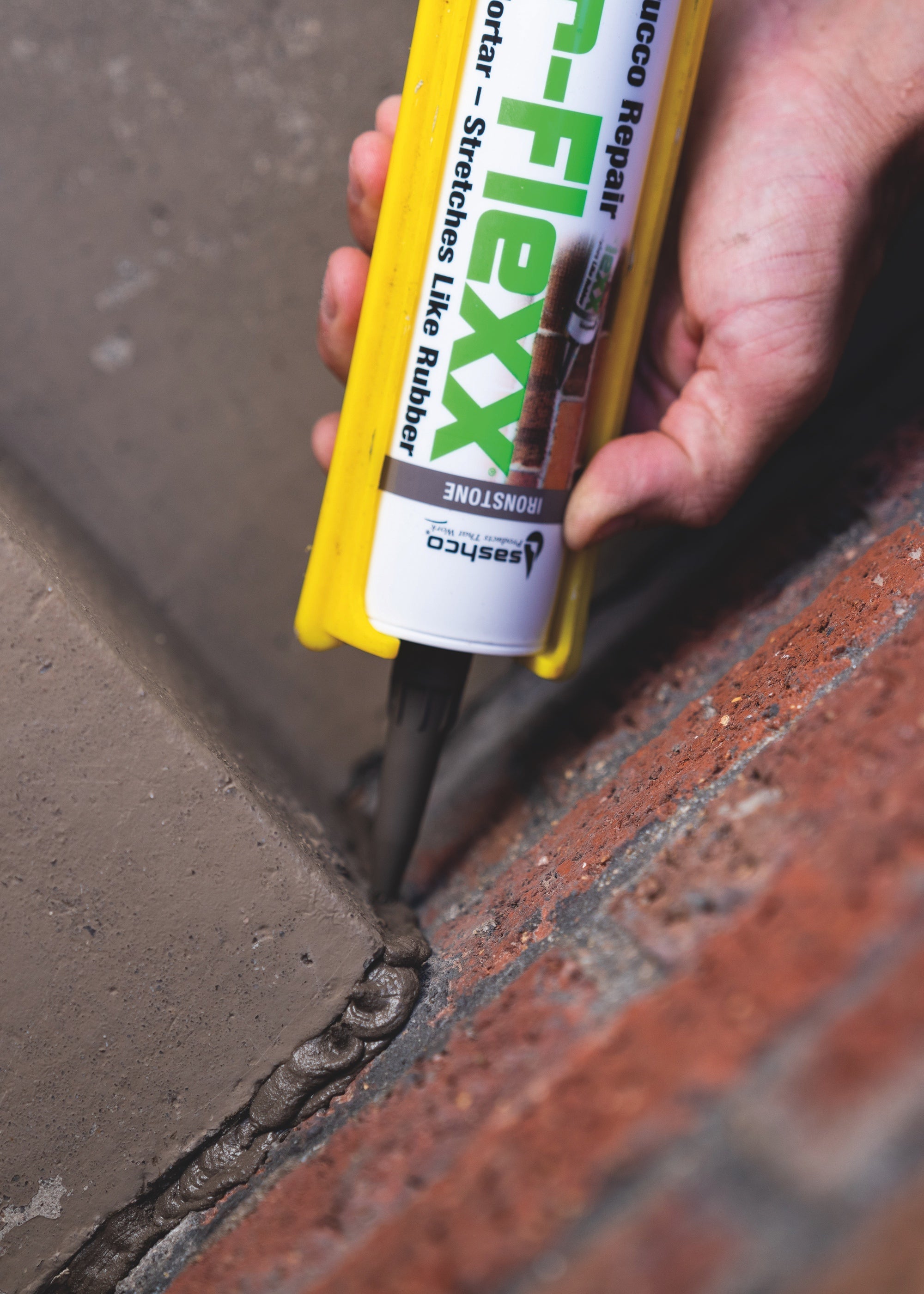 Close-up of Sashco Mor-Flexx mortar repair sealant applied with a caulk gun