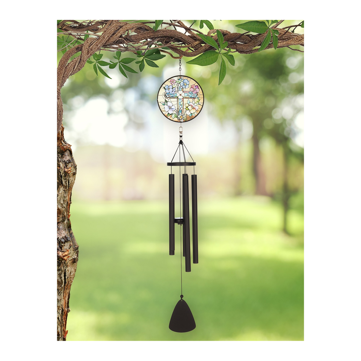 Sunset Vista Designs Stained Glass Cross Wind Chime -- shown hanging from a tree branch