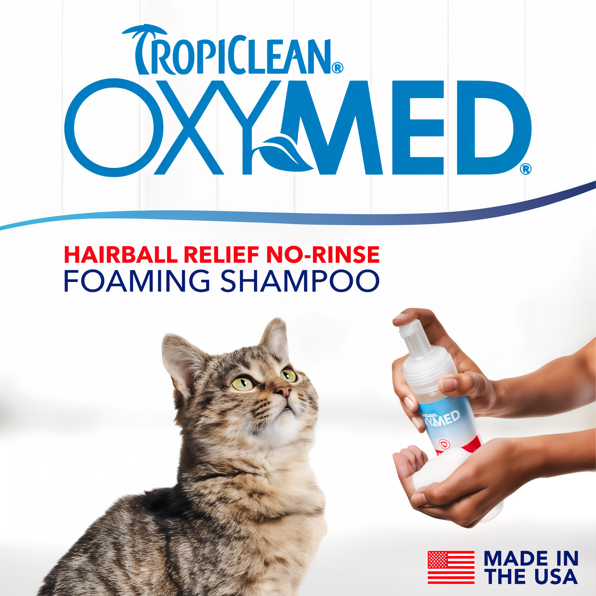 TropiClean OxyMed Waterless Dry Shampoo for Cats, image of cat and a hand with the product