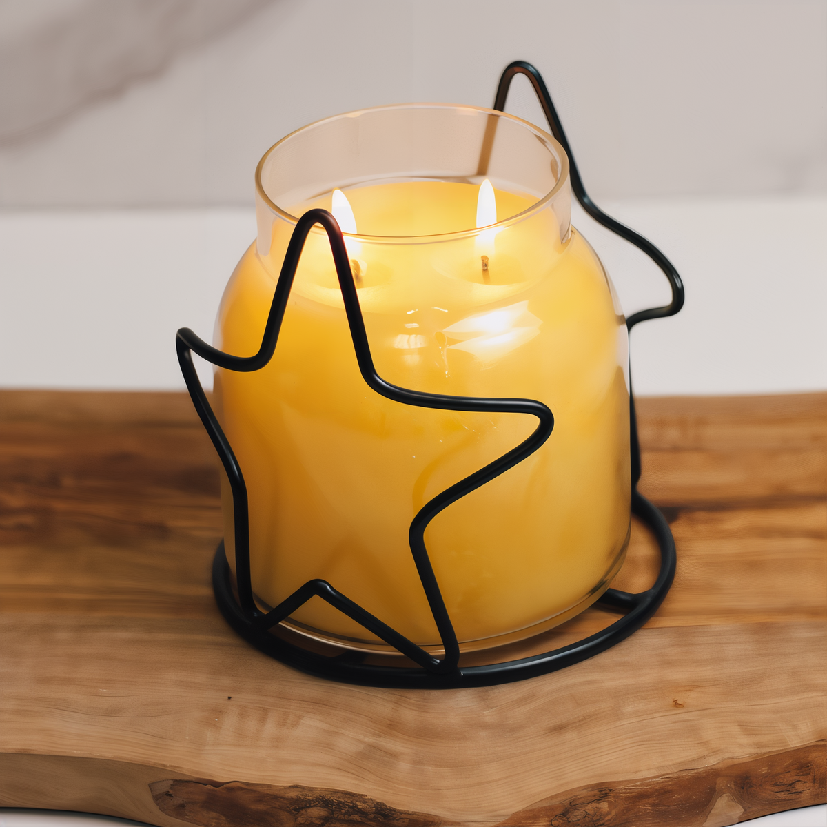 A Cheerful Giver Star Candle Jar Holder -- styled scene with candle