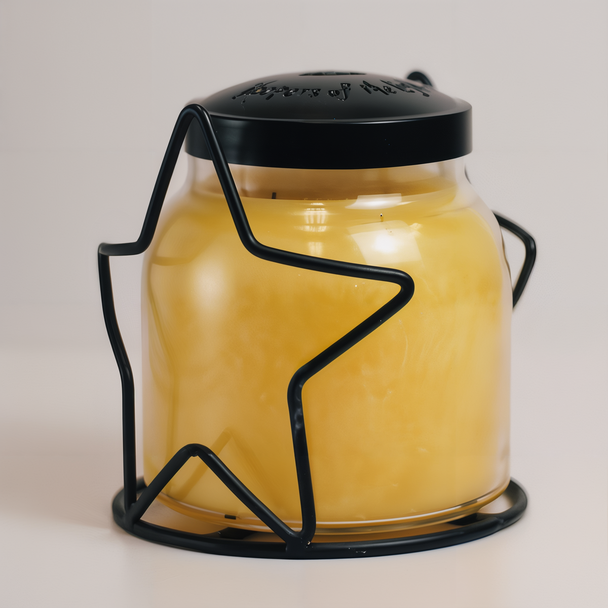 A Cheerful Giver Star Candle Jar Holder -- styled scene with candle