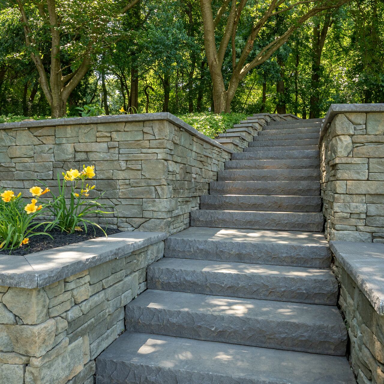 Belgard Belmont Bluestone garden stairway in a landscaped yard
