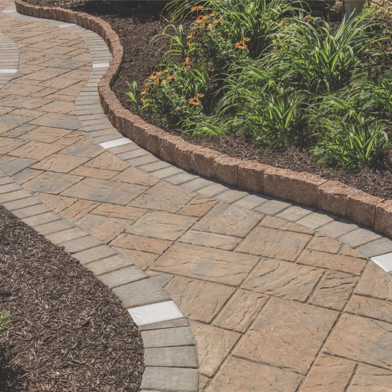 Belgard Edgestone Edger bordering a paver walkway and planting bed
