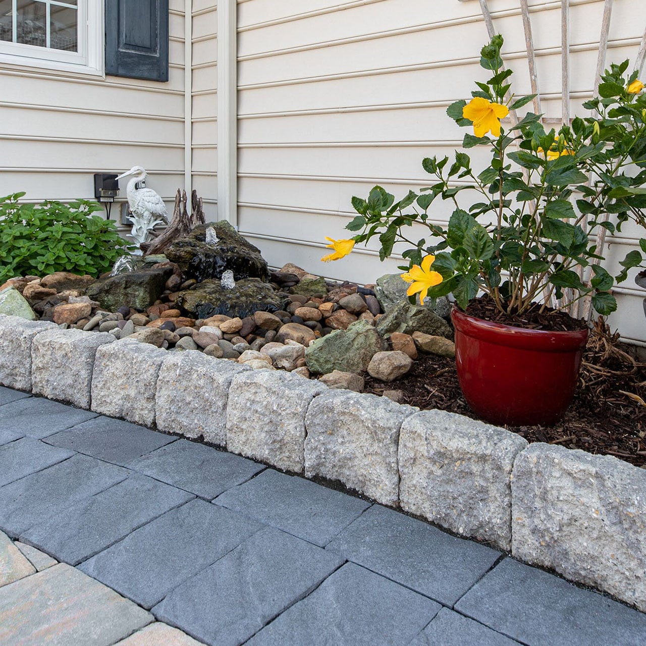 Belgard Edgestone Edger framing a rock-garden water feature