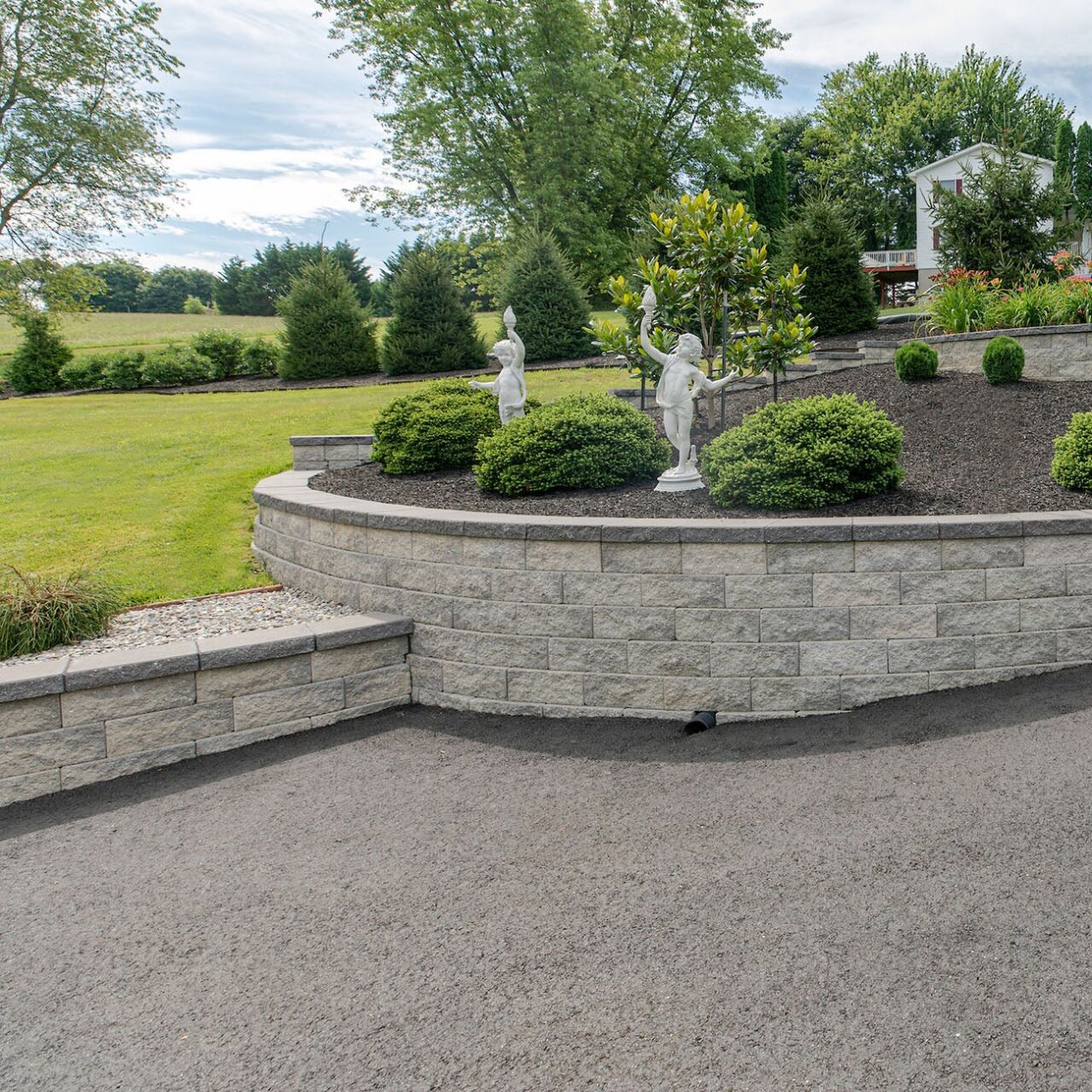 Belgard Terrace Wall split-stone retaining wall in a landscaped yard