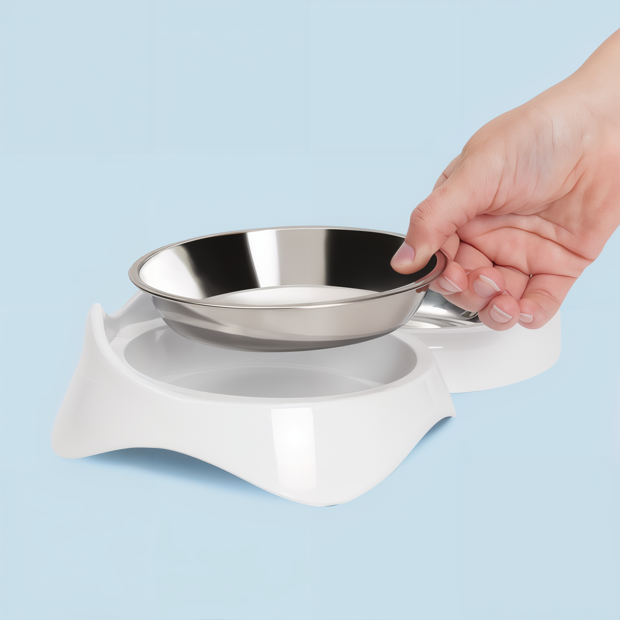 Lifting the removable stainless steel dish out of the Catit PIXI Feeding Dish holder