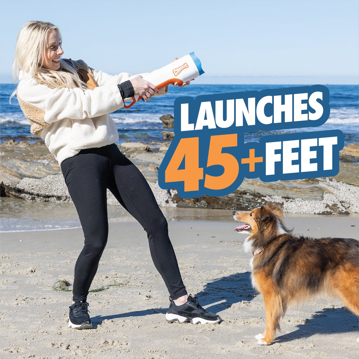 Chuckit! Cannon launches 45 plus feet, woman and dog playing fetch on a beach