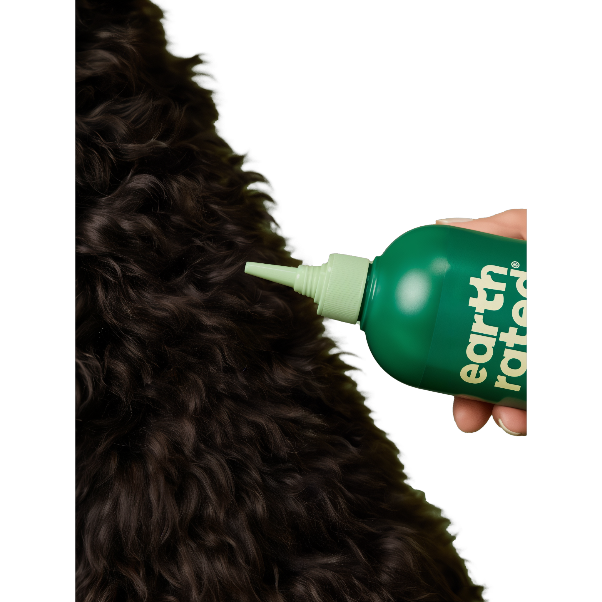 Deep-clean nozzle works Earth Rated detangling shampoo through dense curls