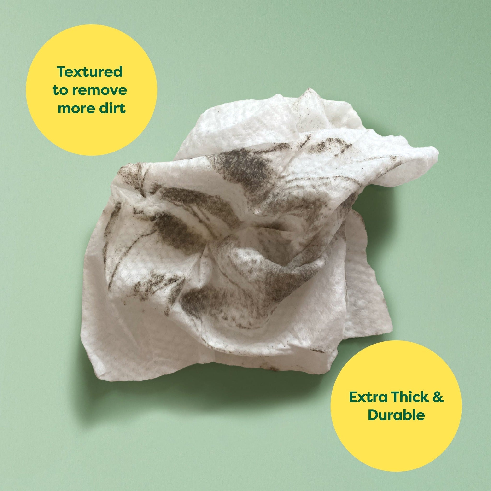 Textured, durable Earth Rated wipe lifting dirt from a dog paw
