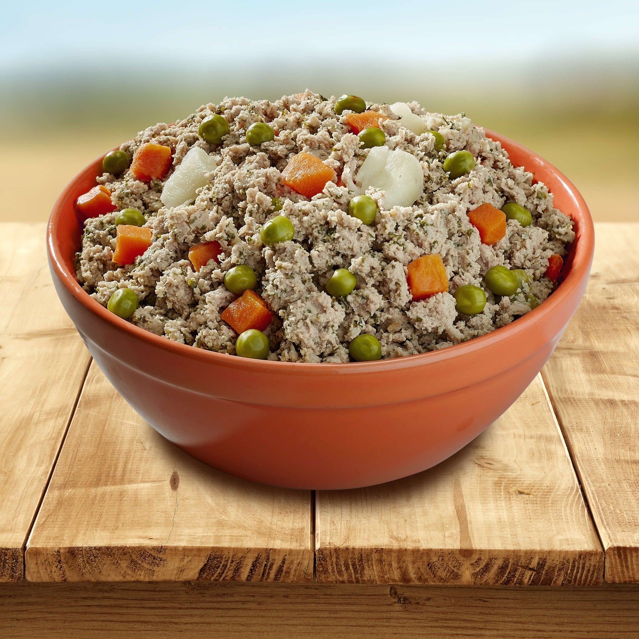 Bowl of Bonnihill Farms ChickiBowls gently cooked chicken recipe with peas, carrots, and potatoes