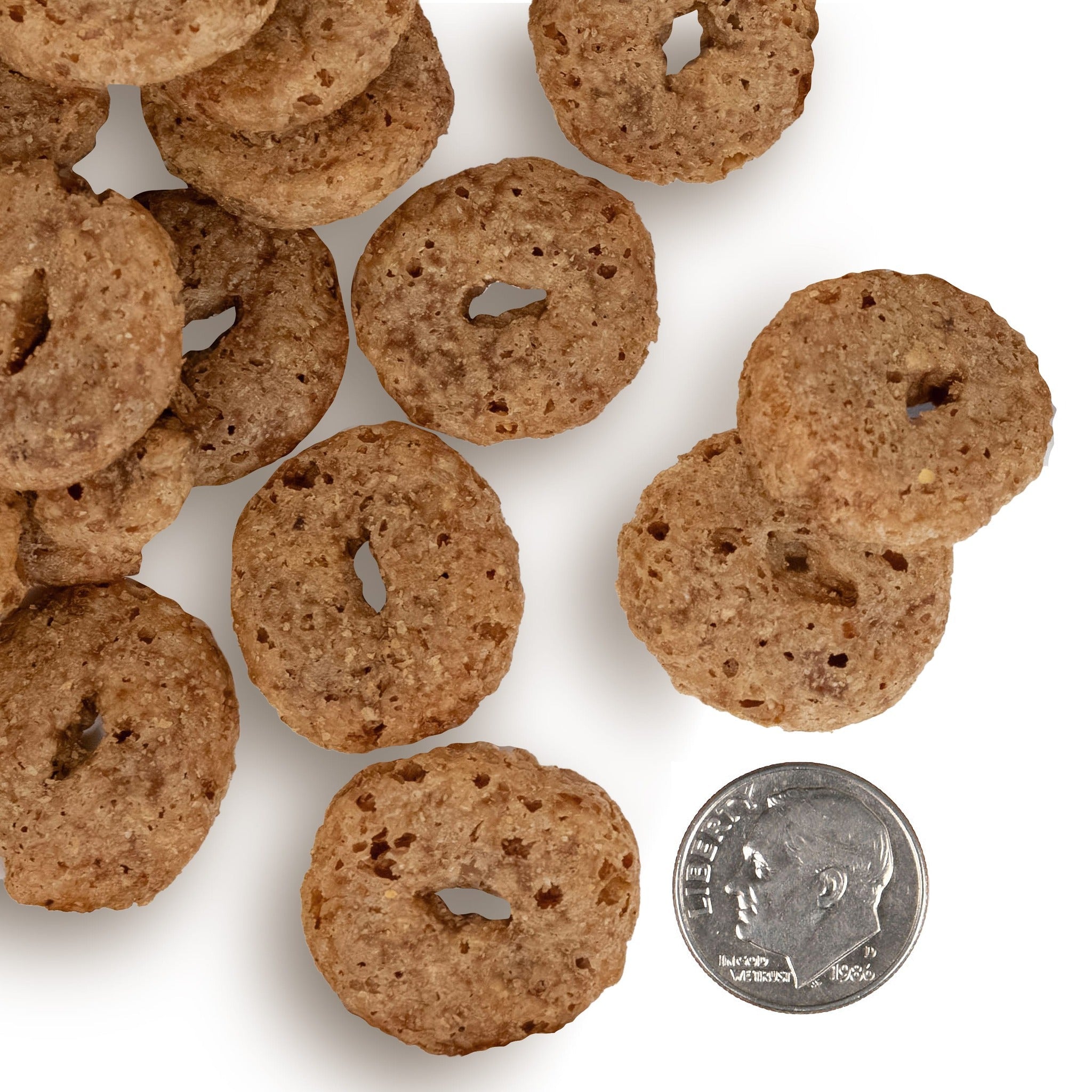 Fromm Crunchy O's Bacon Blasters treats shown next to a dime for scale