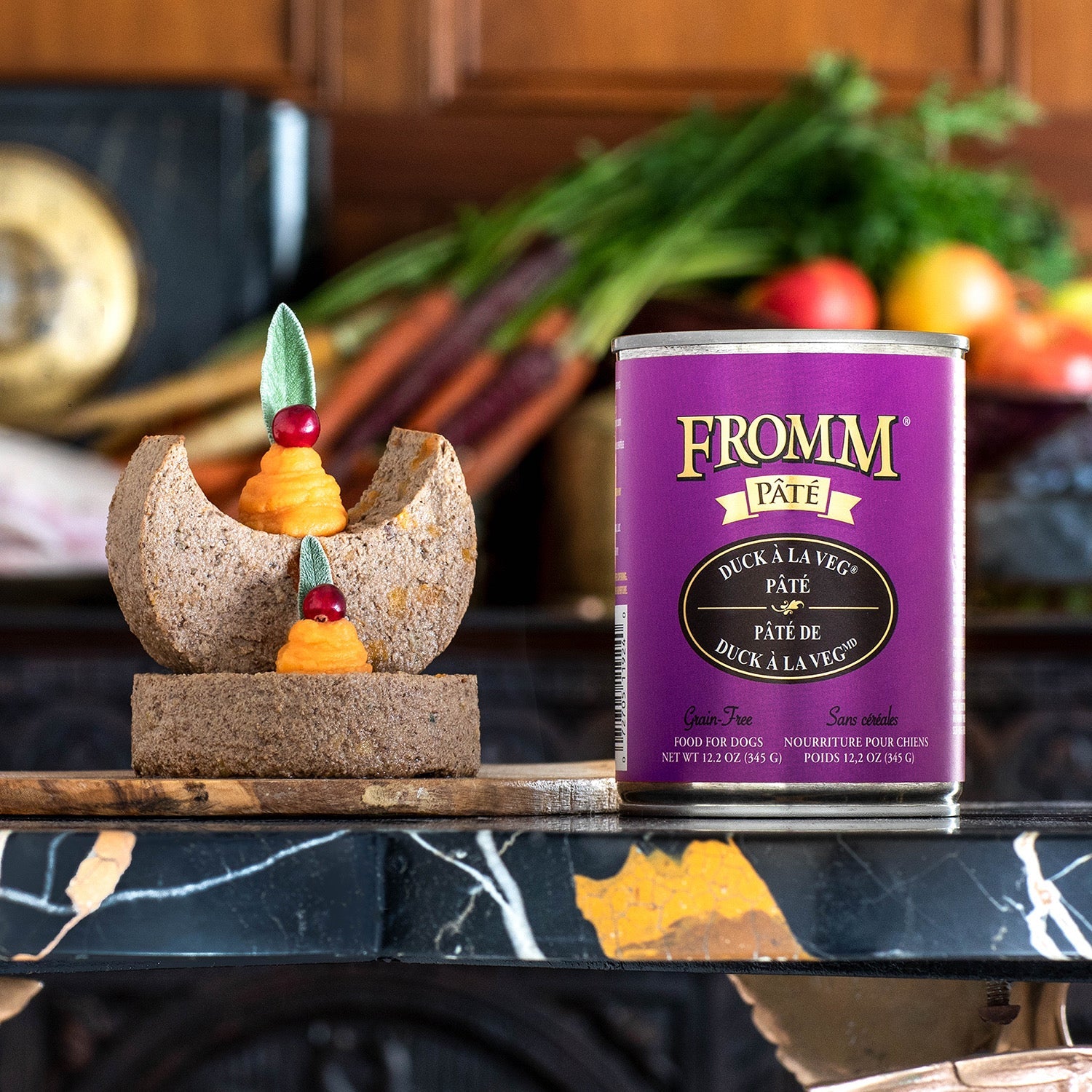 A can of Fromm Pâté Duck À La Veg beside plated pâté garnished with sweet potato purée, cranberries, and sage
