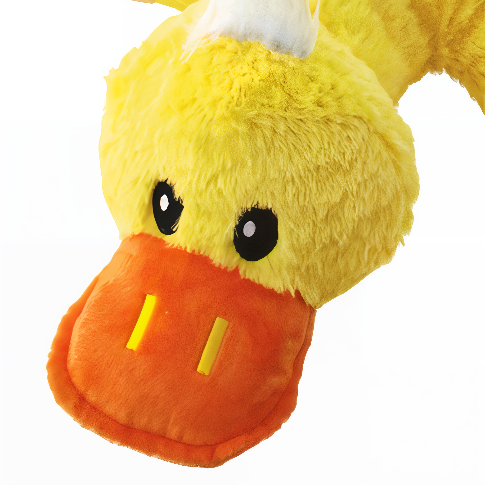 Close-up of the KONG Comfort Jumbo Duck Dog Toy yellow duck face and beak