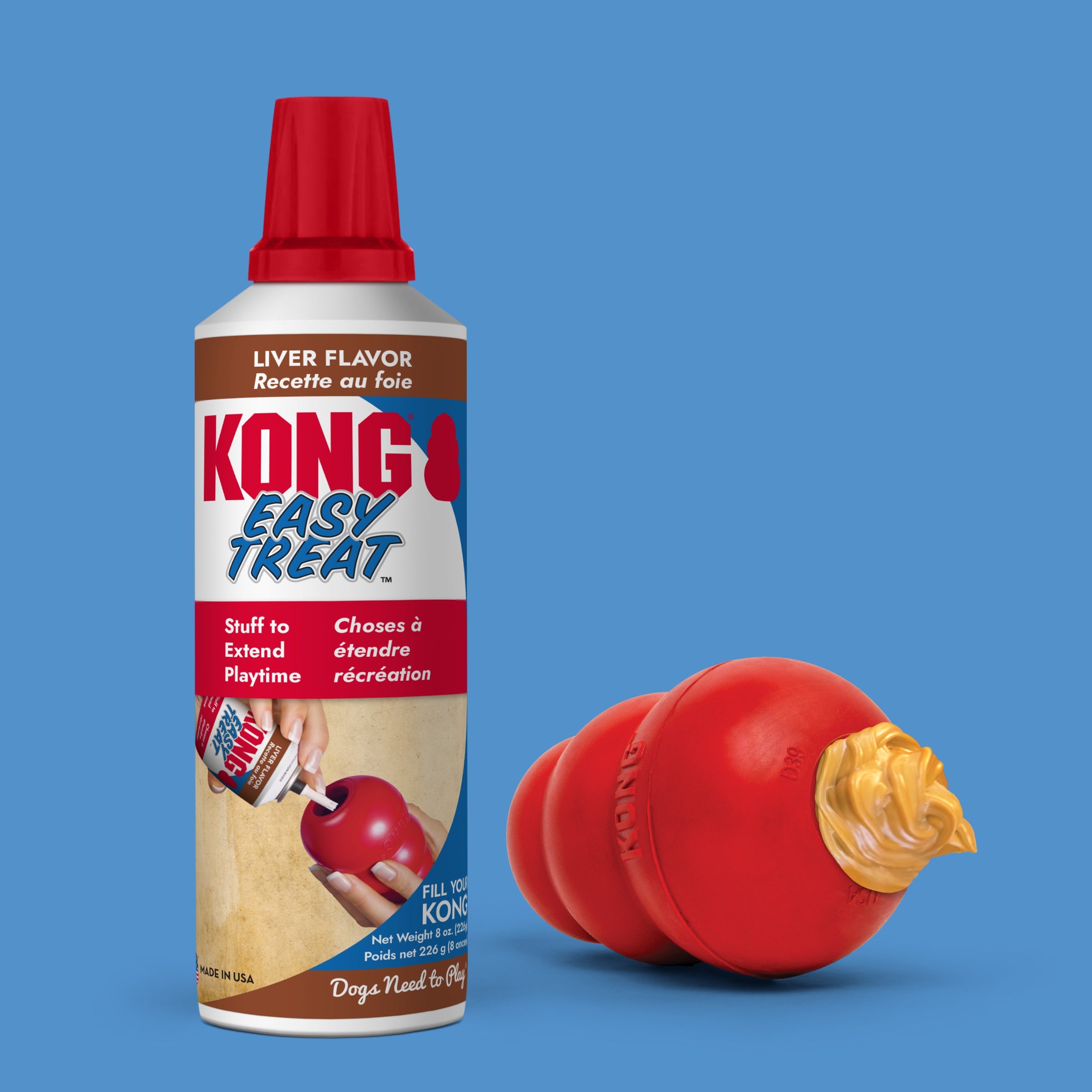 KONG Easy Treat Liver Flavor can beside a red KONG rubber toy