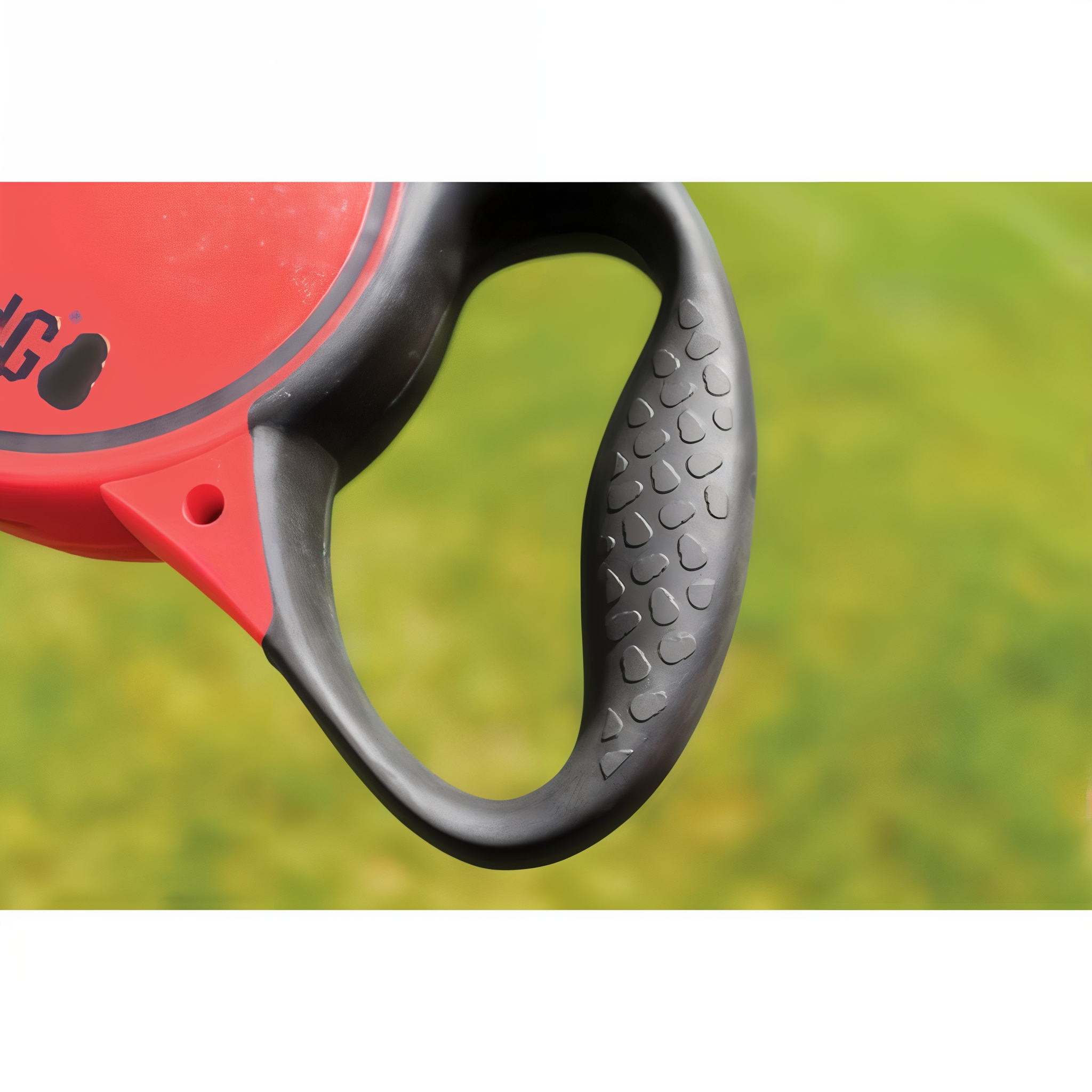 Close-up of the textured soft grip handle on the KONG Terrain retractable leash