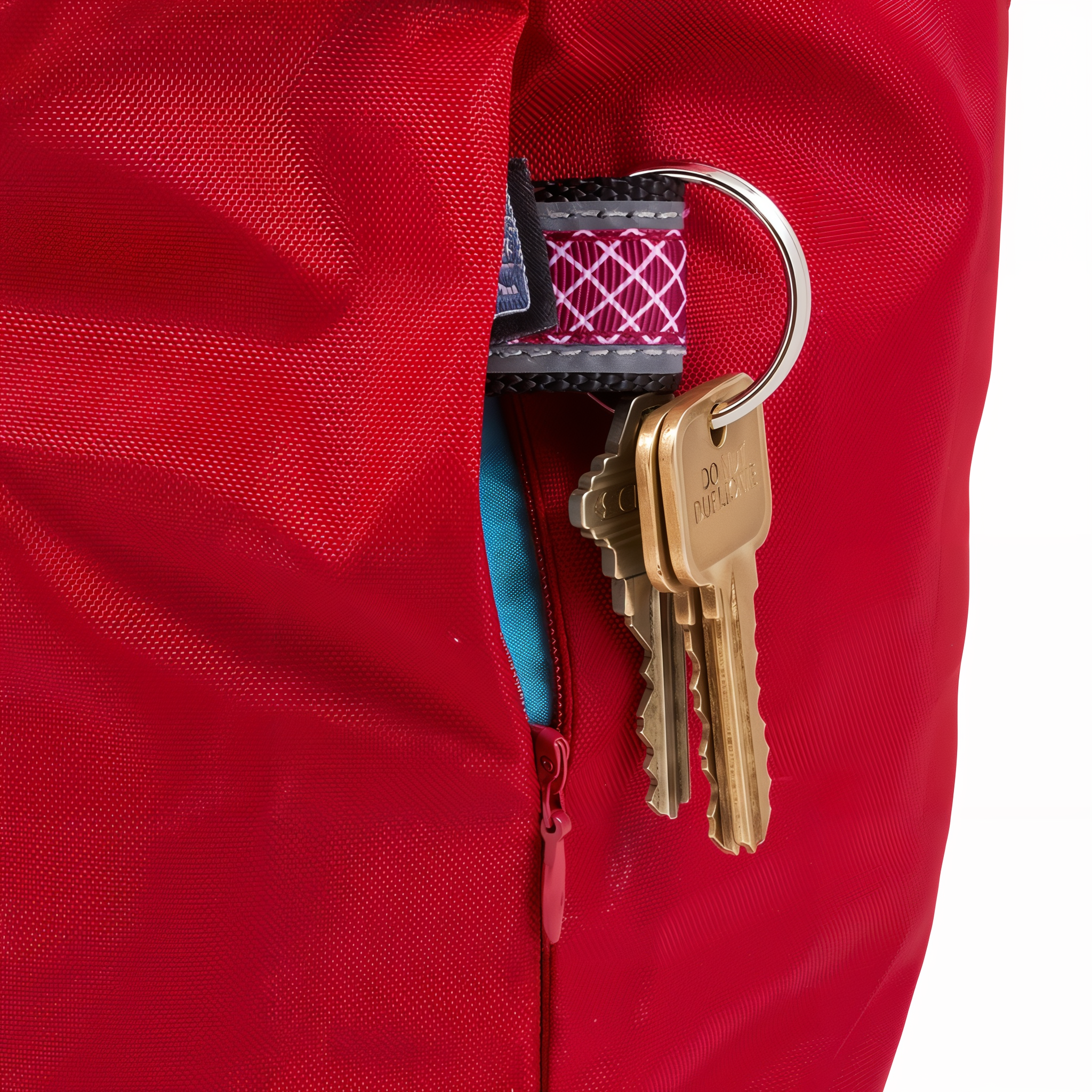 Keys stored in the zippered side pocket of the Kurgo Kibble Carrier