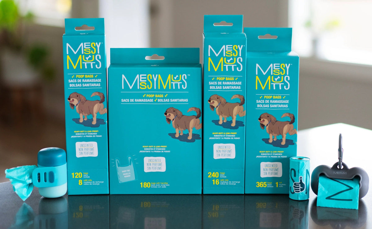Messy Mutts poop management collection of bag boxes, refill rolls and dispenser on a counter