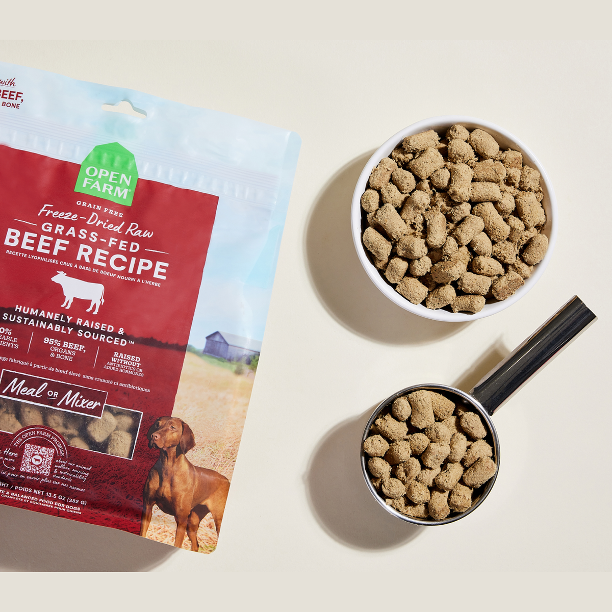 Open Farm Grass-Fed Beef Freeze Dried Raw Morsels for Dogs -- open farm grass-fed beef freeze dried morsels in a bowl and measuring scoop
