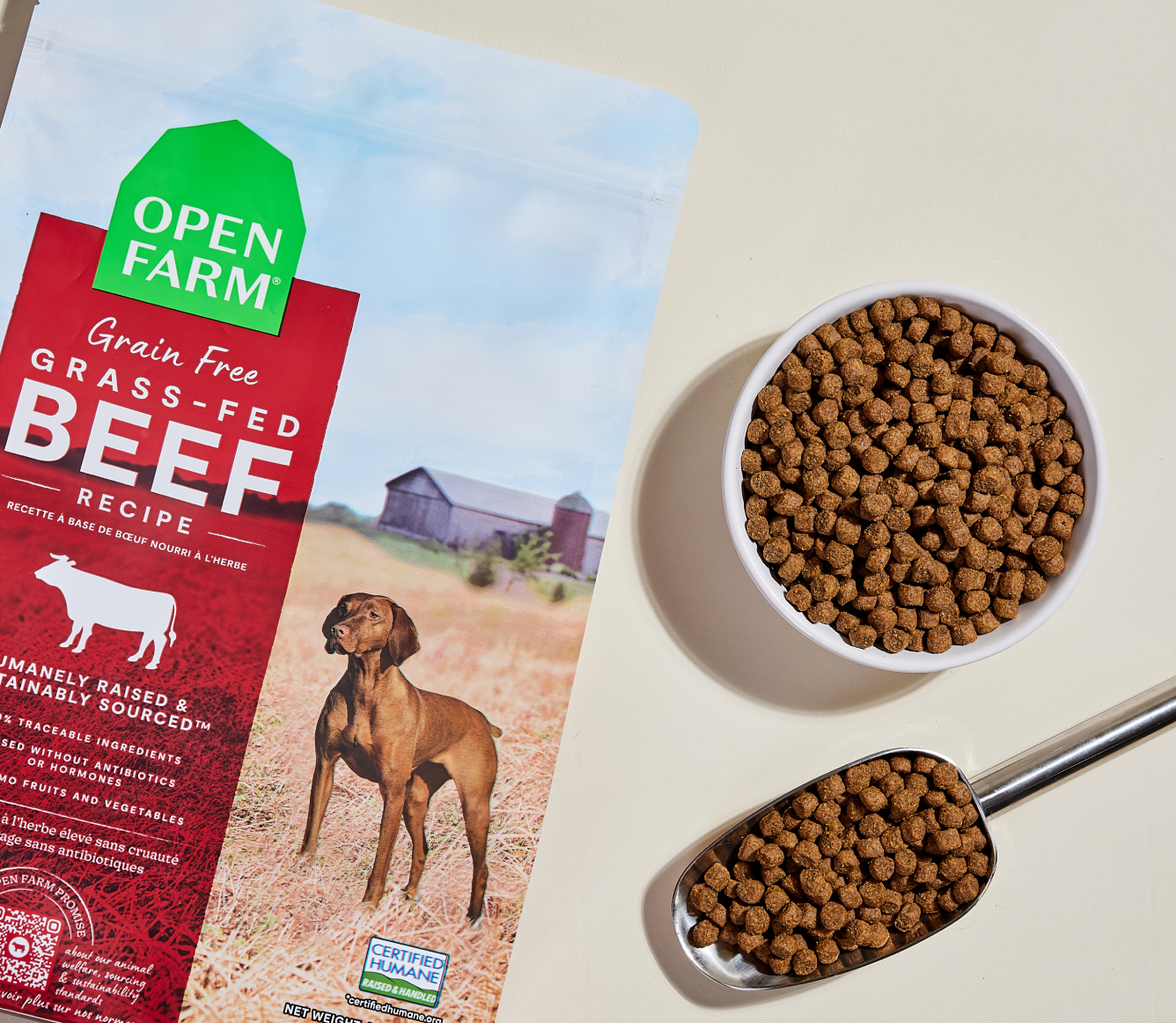 Open Farm Grass-Fed Beef Grain-Free Dog Kibble kibble in a bowl with a serving scoop