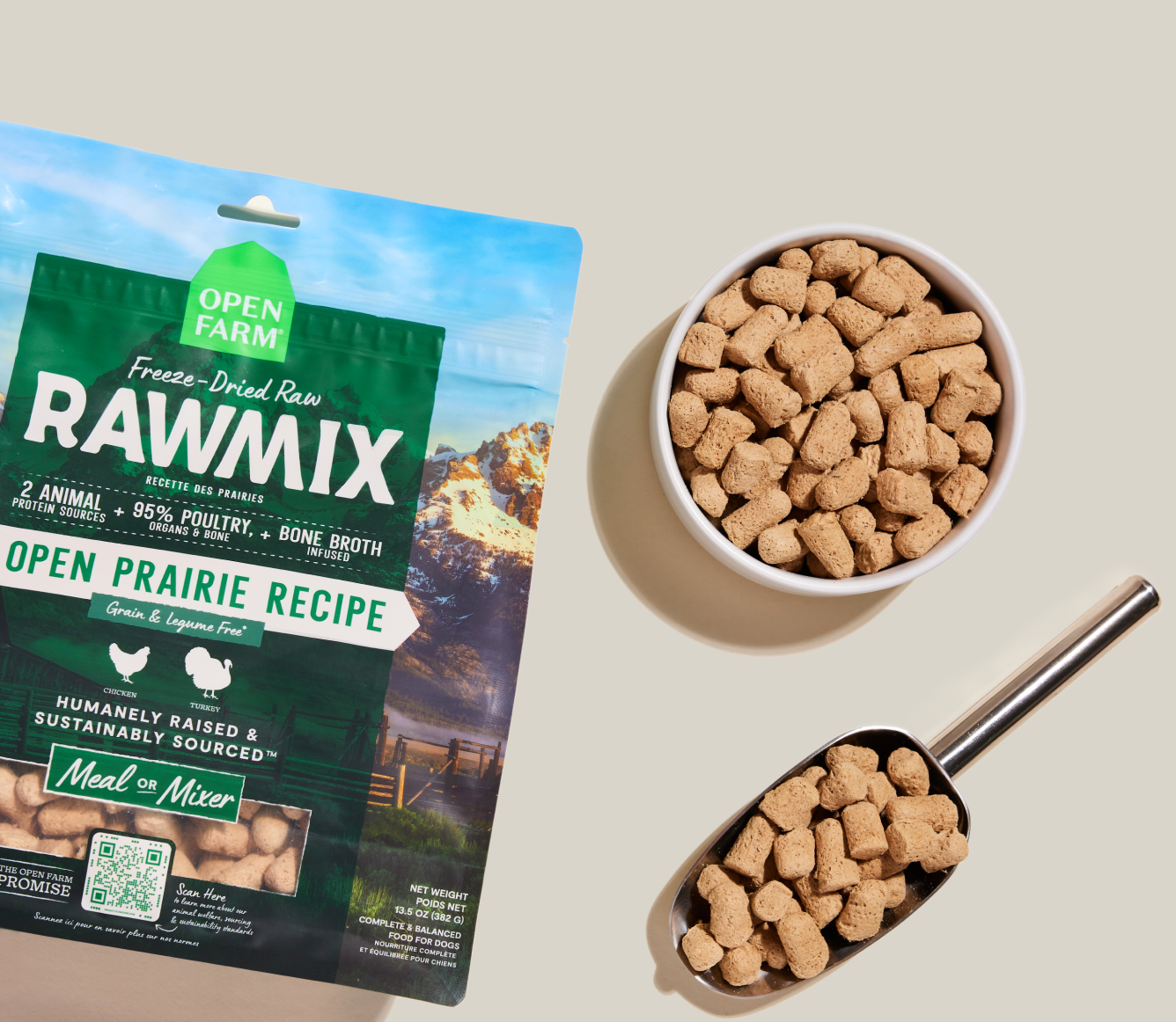 Open Farm RawMix Open Prairie freeze dried morsels in a bowl and measuring scoop