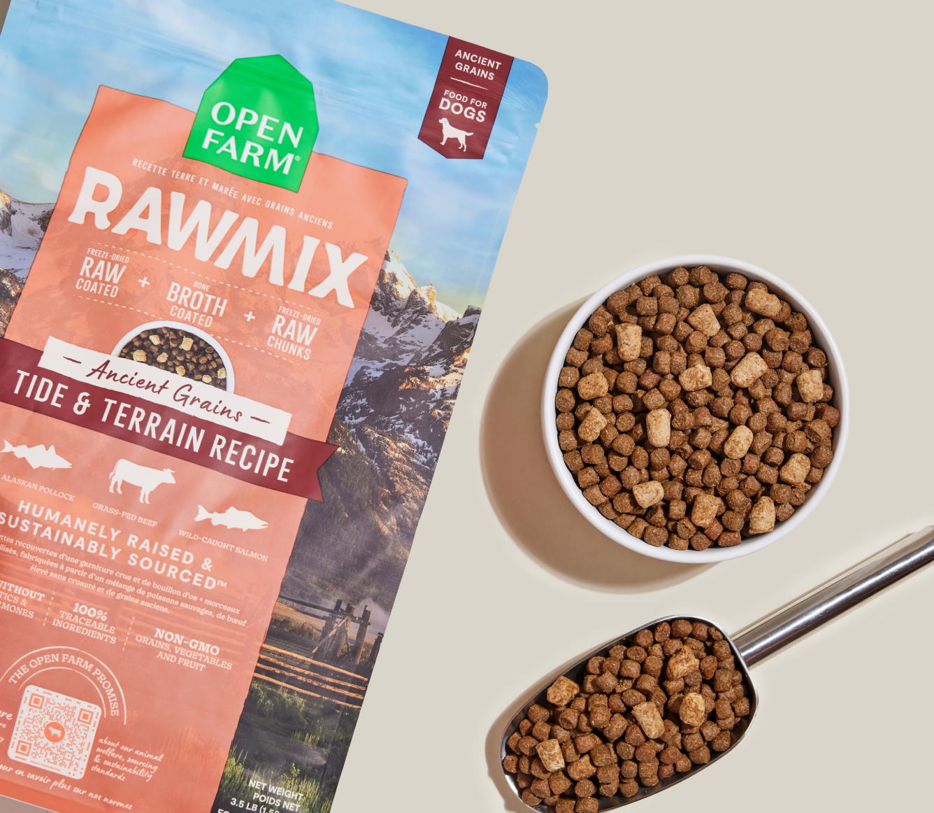 Open Farm RawMix Tide & Terrain Ancient Grains Dog Kibble bag with a bowl of kibble