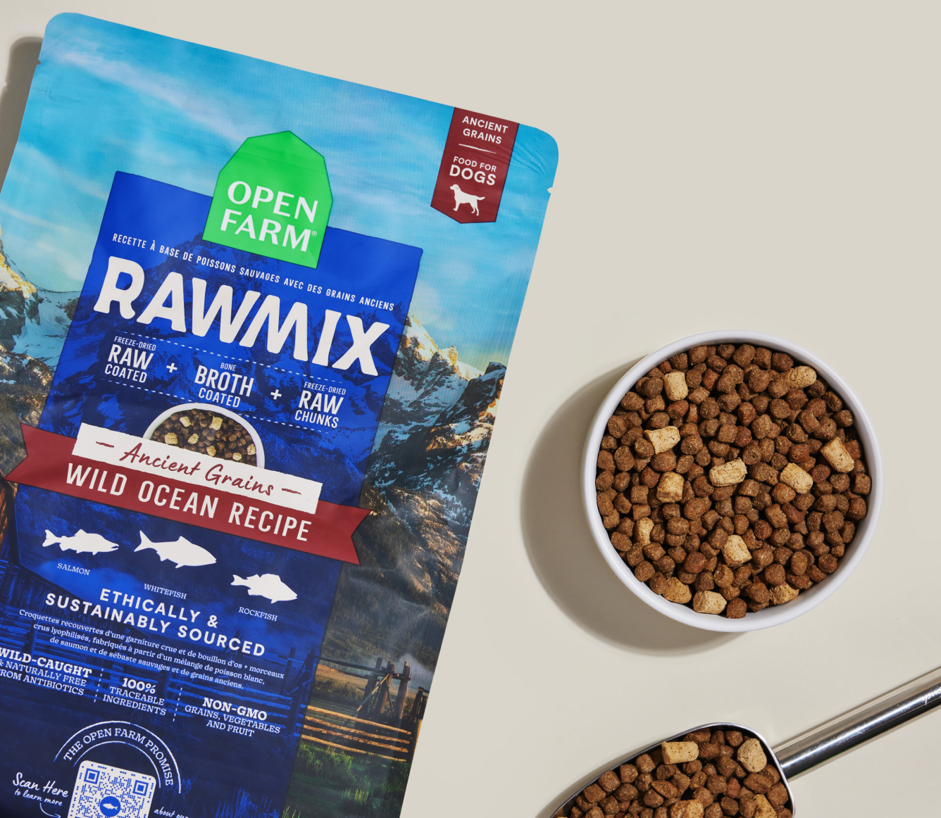 Open Farm RawMix Wild Ocean Ancient Grains Dog Kibble bag with a bowl of kibble