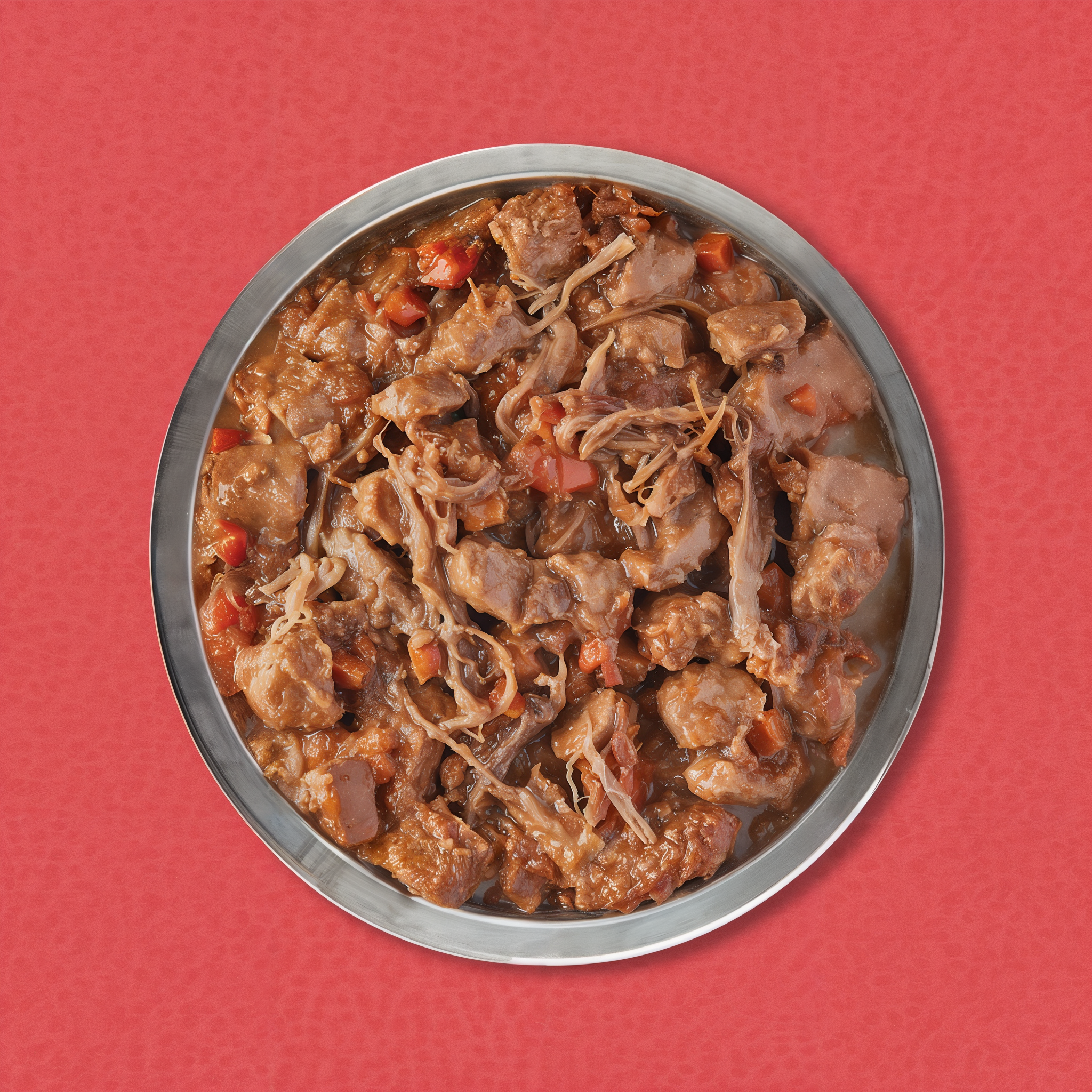 Bowl of ORIJEN Beef Recipe Stew showing chunks and shreds of beef with carrots in savory gravy