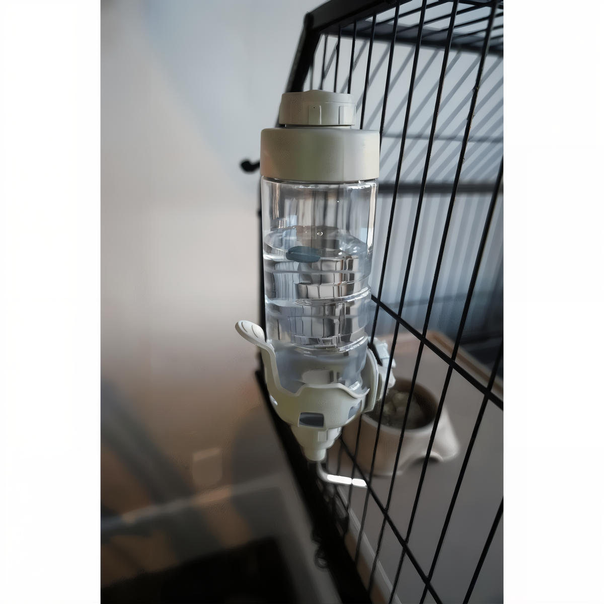 Small Dripless Water Bottle mounted on a habitat