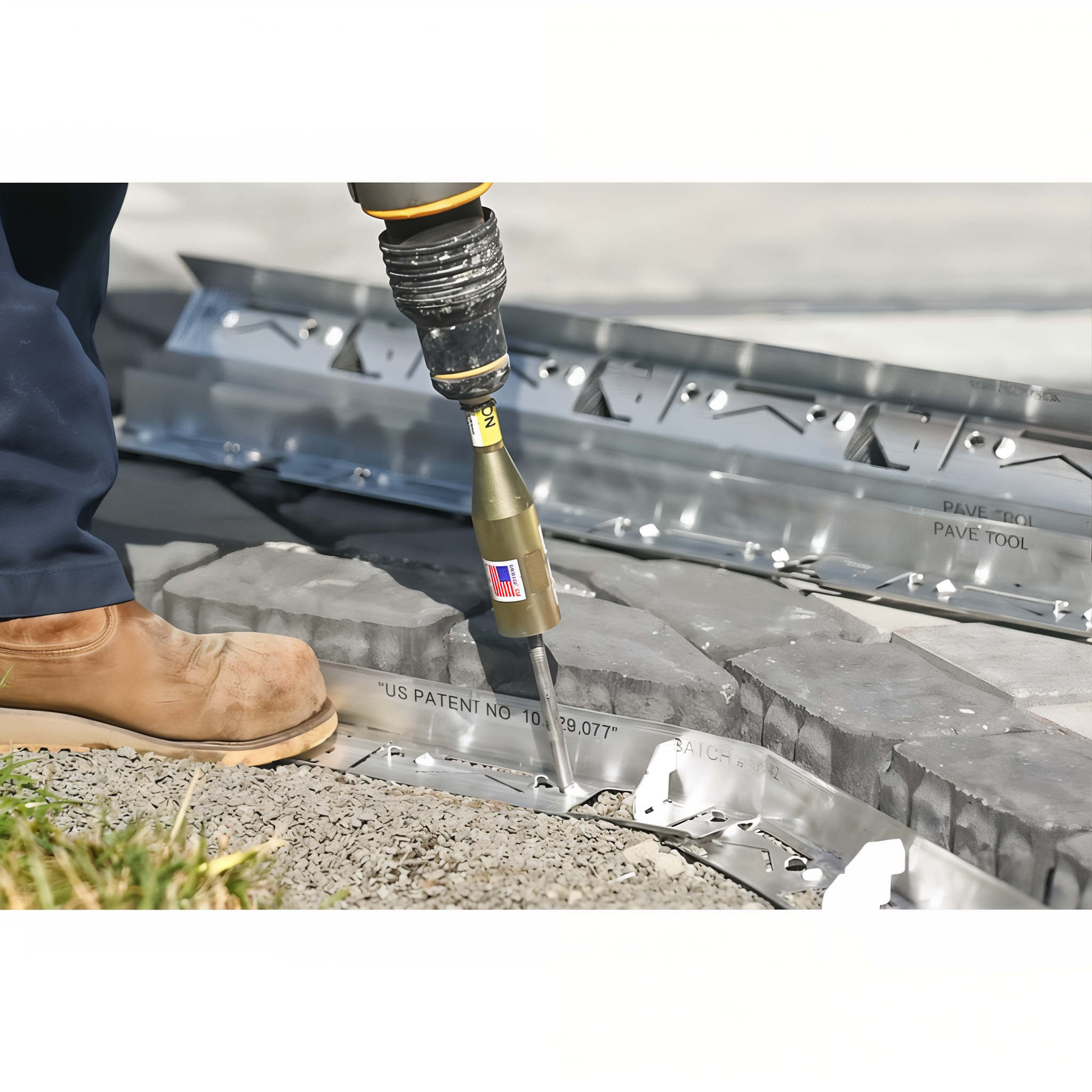 Installing 10 inch steel spikes through Pave Tool Hybrid HD PVC edging using the Quick-E-Hammer