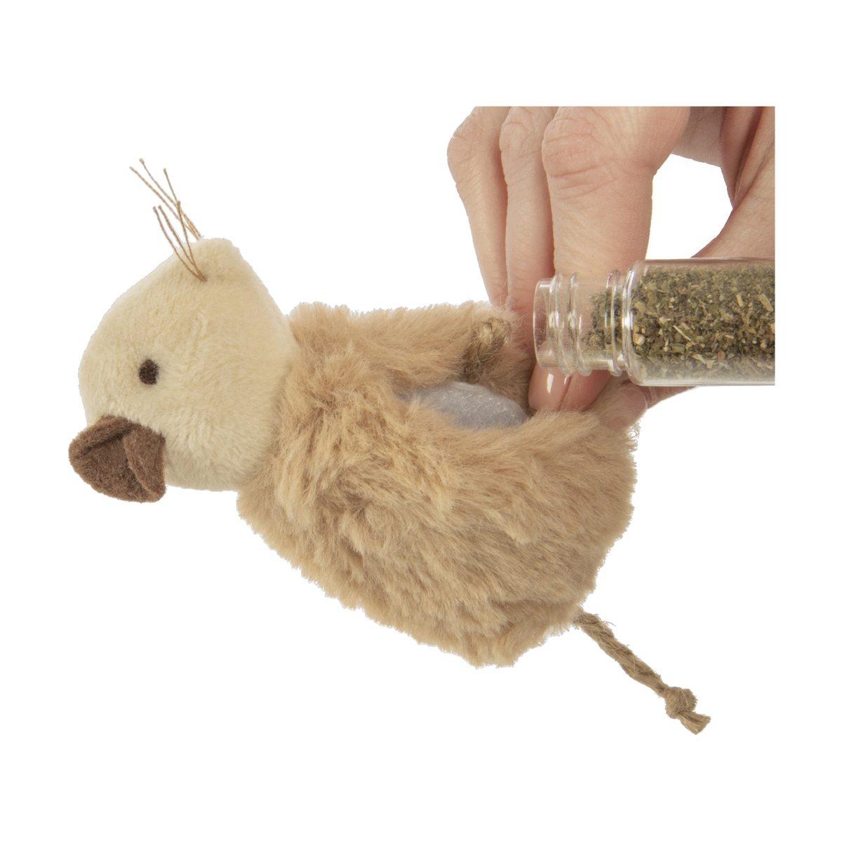 Refilling the SmartyKat Madcap Mania mouse with catnip from the dispensing tube