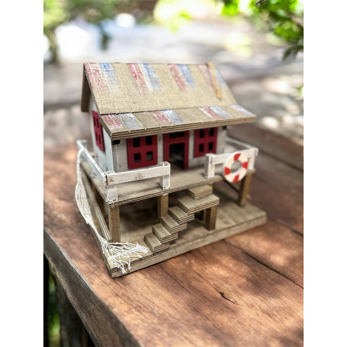 Sunset Vista Designs Beach Home Birdhouse -- shown on a wooden table