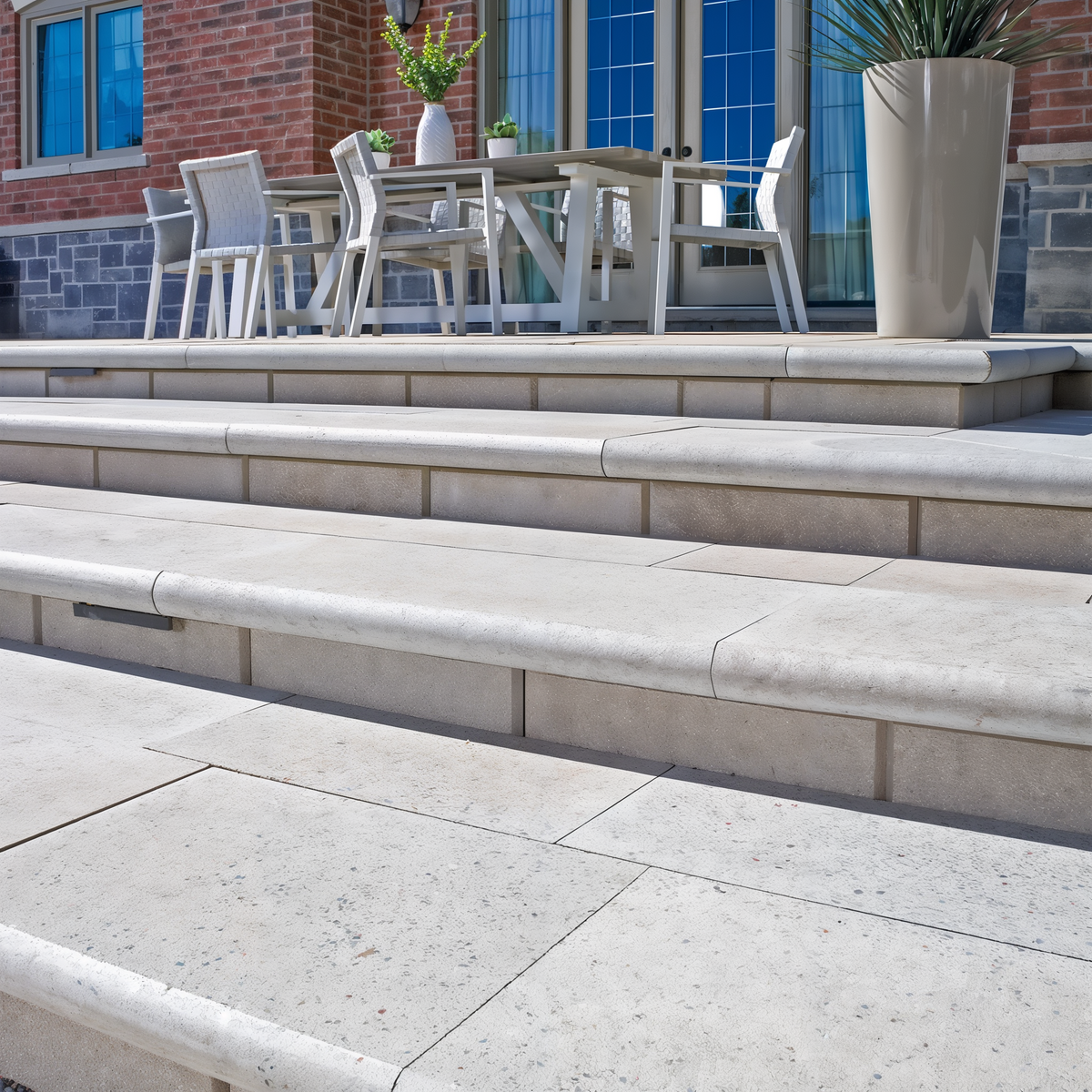 Bullnose Grande Cap Greyed Nickel Smooth patio steps leading.