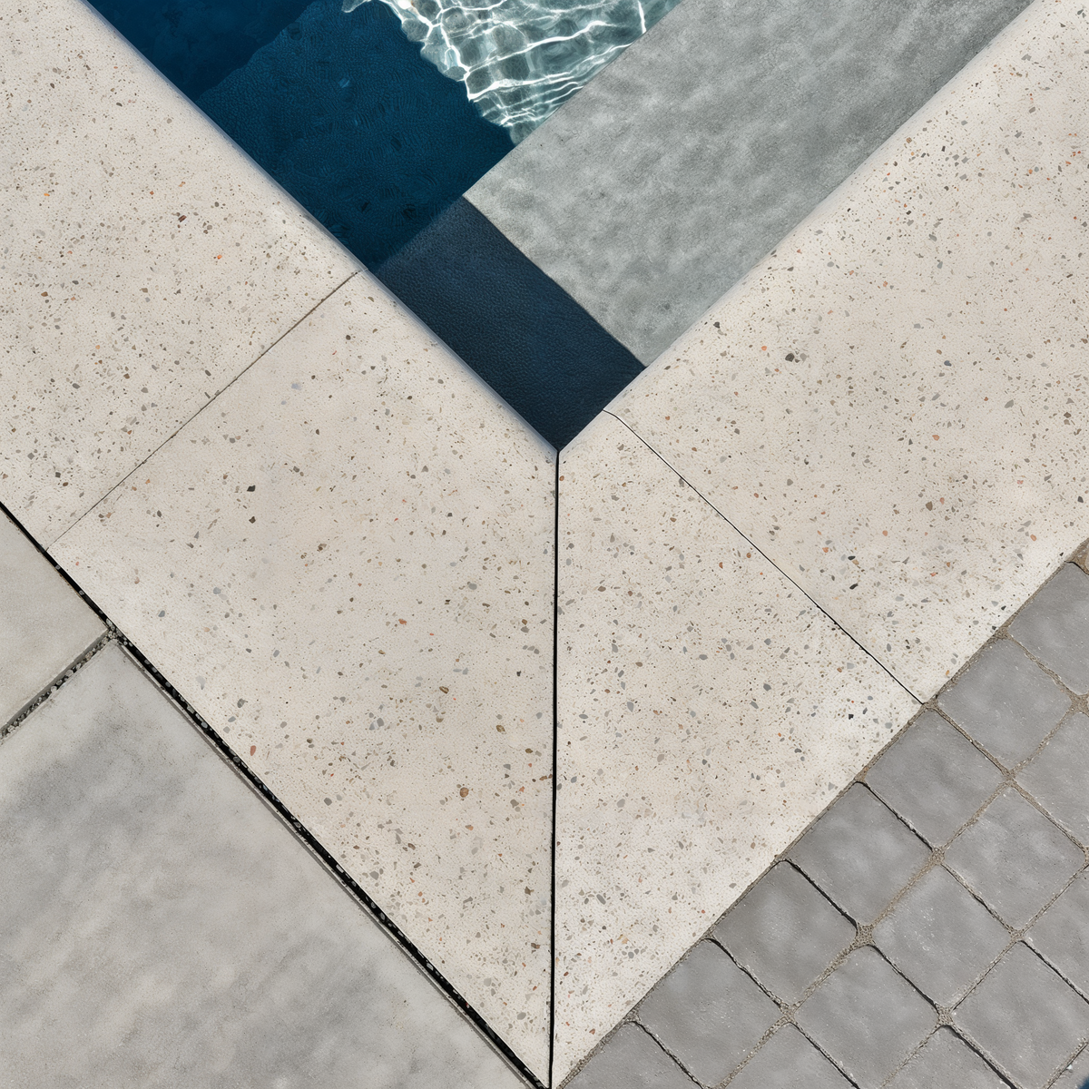 Bullnose Grande Cap Greyed Nickel Smooth pool coping corner.