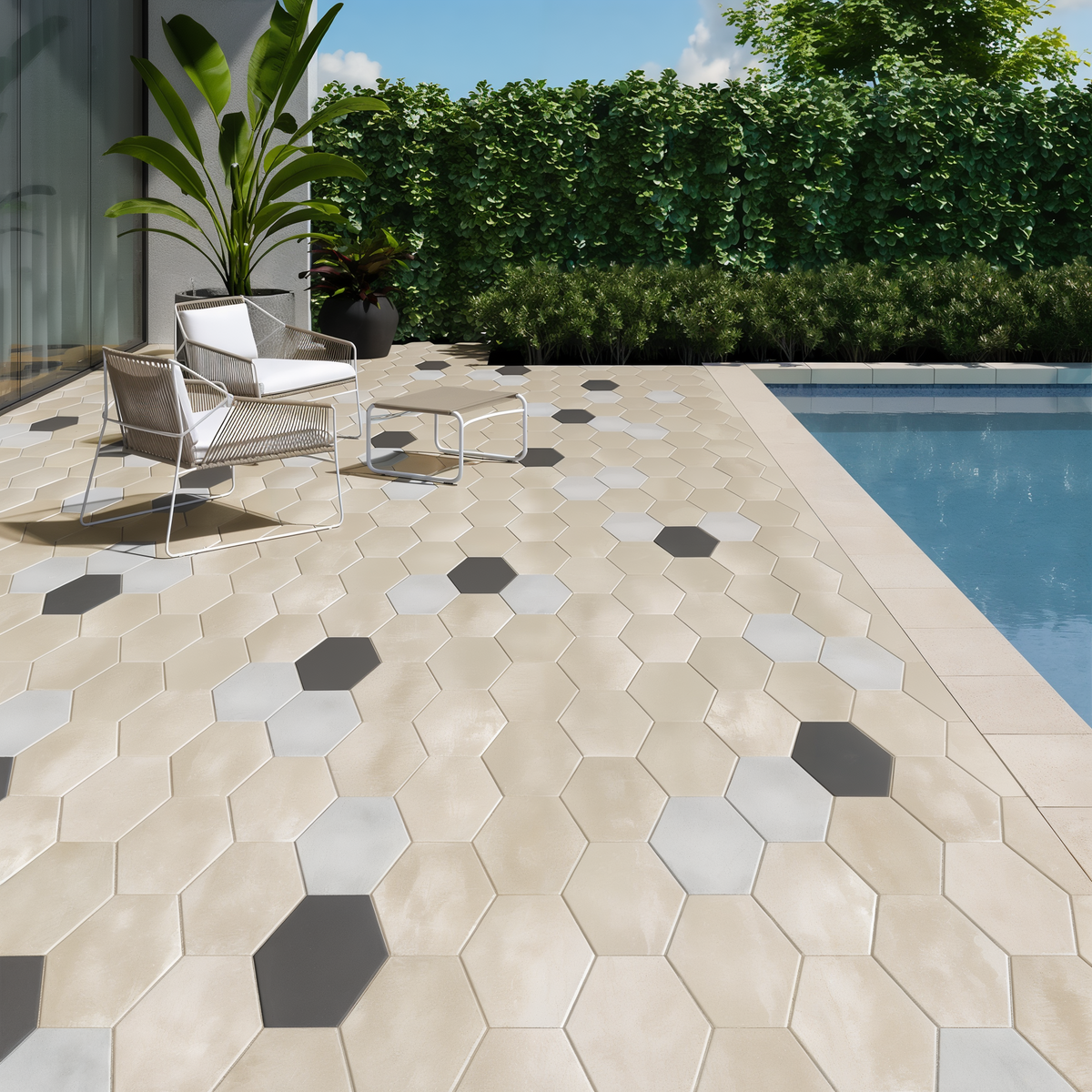 Hexa 60 Slab patio accents in Onyx Black beside a pool with light hexagonal paving.