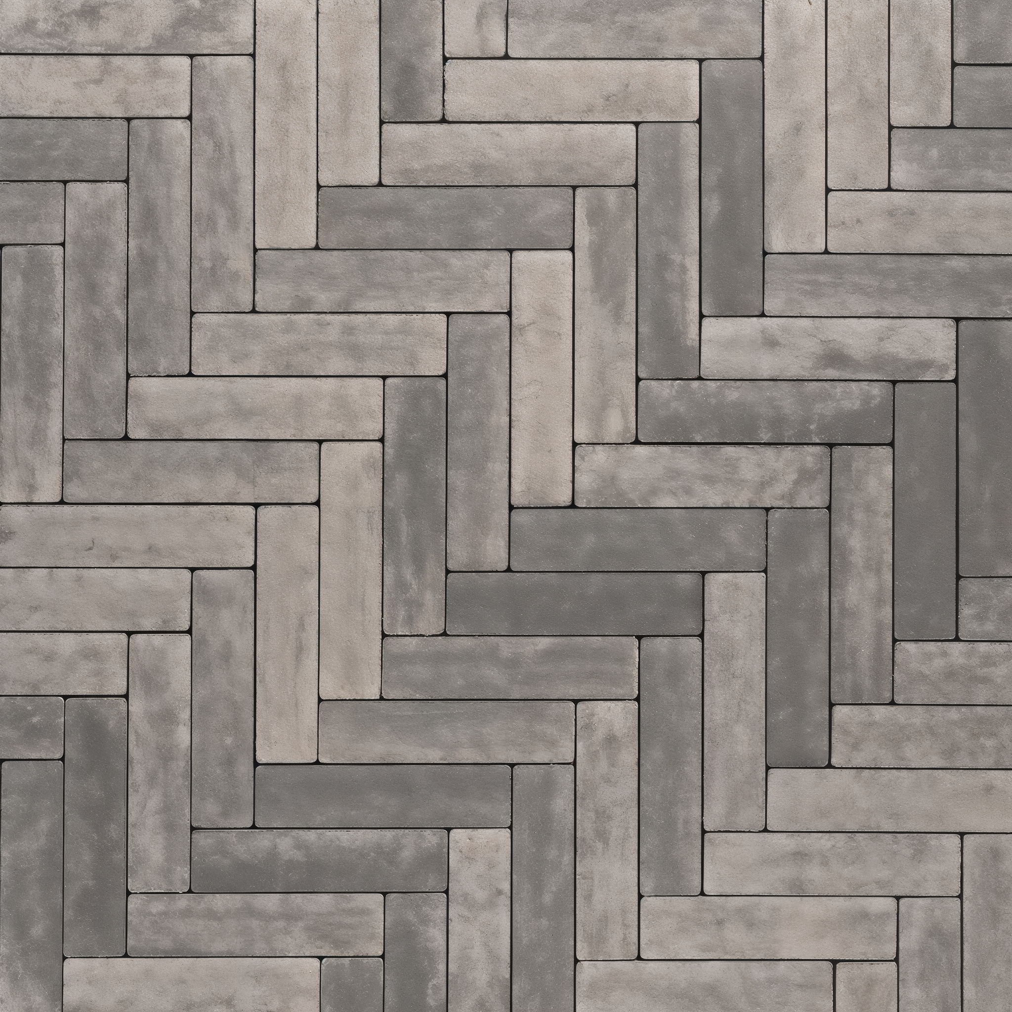 Westmount Shale Grey HD² Smooth paver herringbone walkway close-up; Onyx Black Single Size.