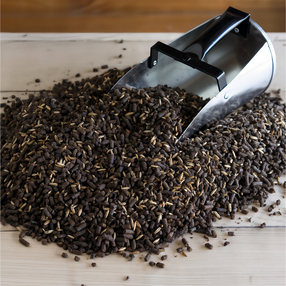 Close-up of Triple Crown Growth textured horse feed with a feed scoop