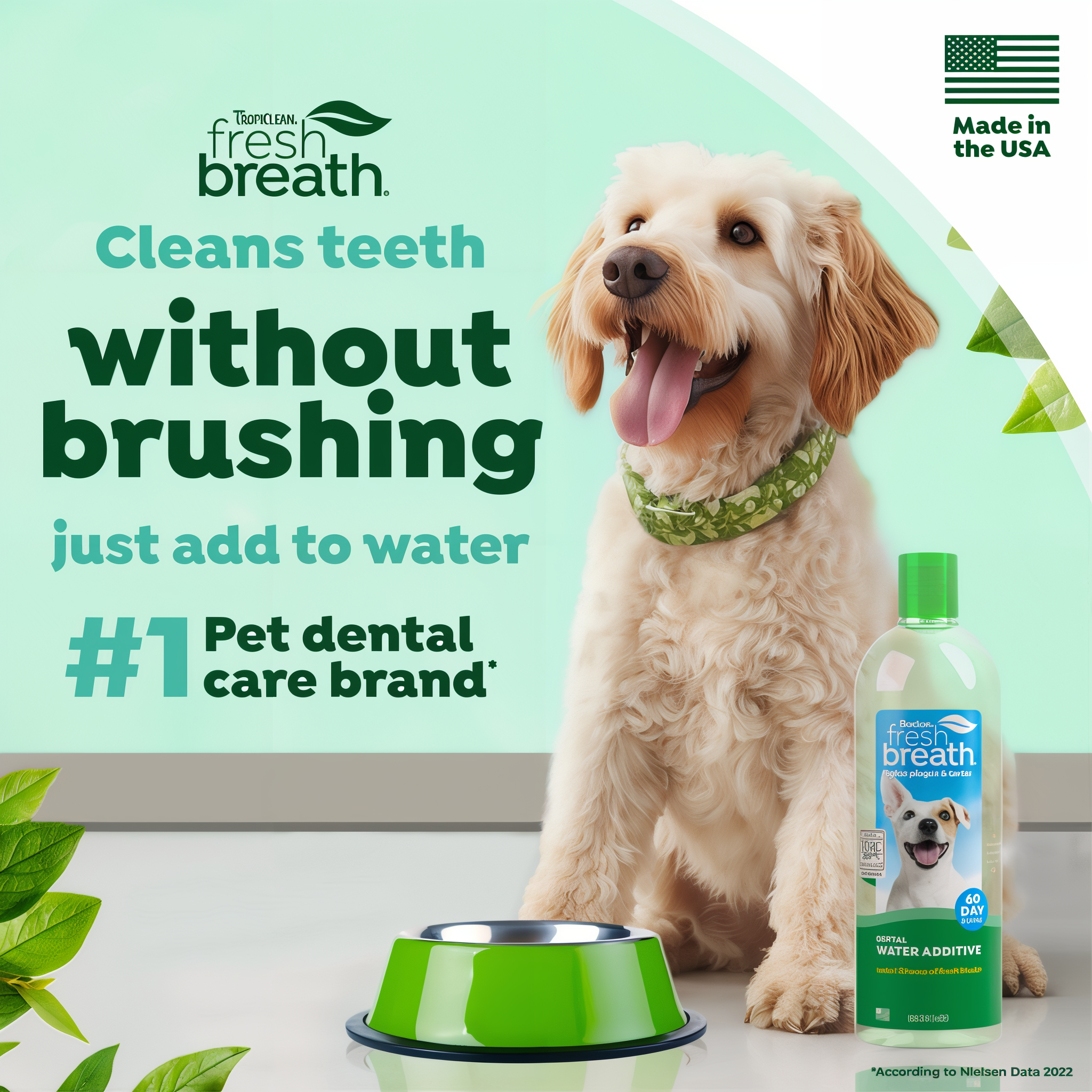 TropiClean Fresh Breath water additive bottle displayed next to a tan dog and green pet bowl.
