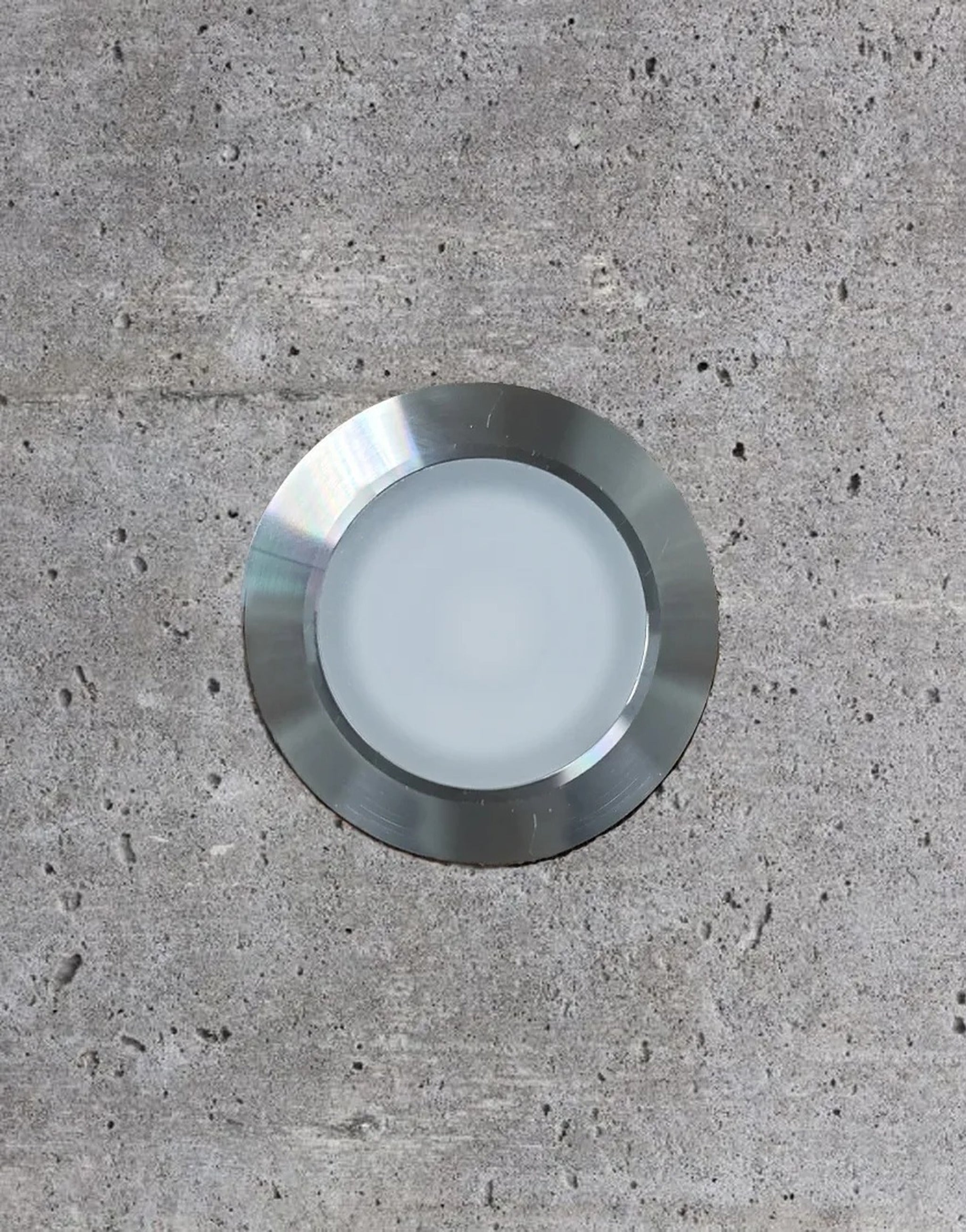 Tru-Scapes Modern 2.5" Dot Light installed in a concrete walkway — top-down view #Stainless Steel#4000K#2 1/2"