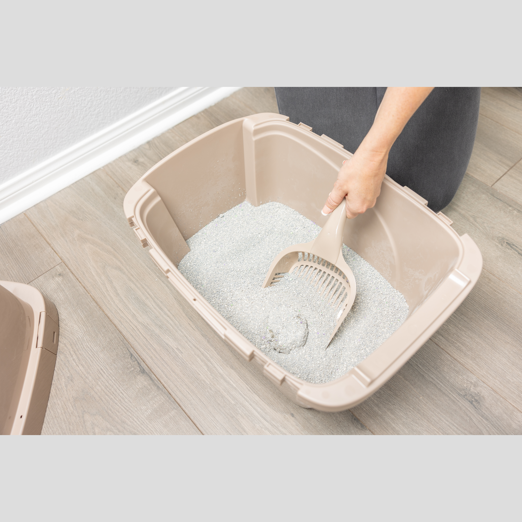 Van Ness Giant Litter Scoop scooping litter in an enclosed cat pan